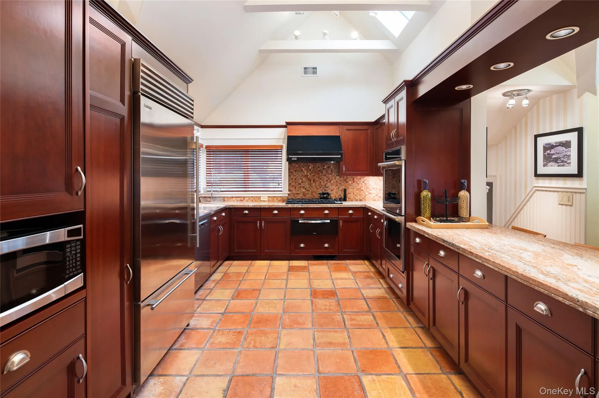 All new appliances in an easy work space kitchen showing skylights and vaulted beamed ceiling. All new appliances in an easy work space kitchen showing skylights and vaulted beamed ceiling.