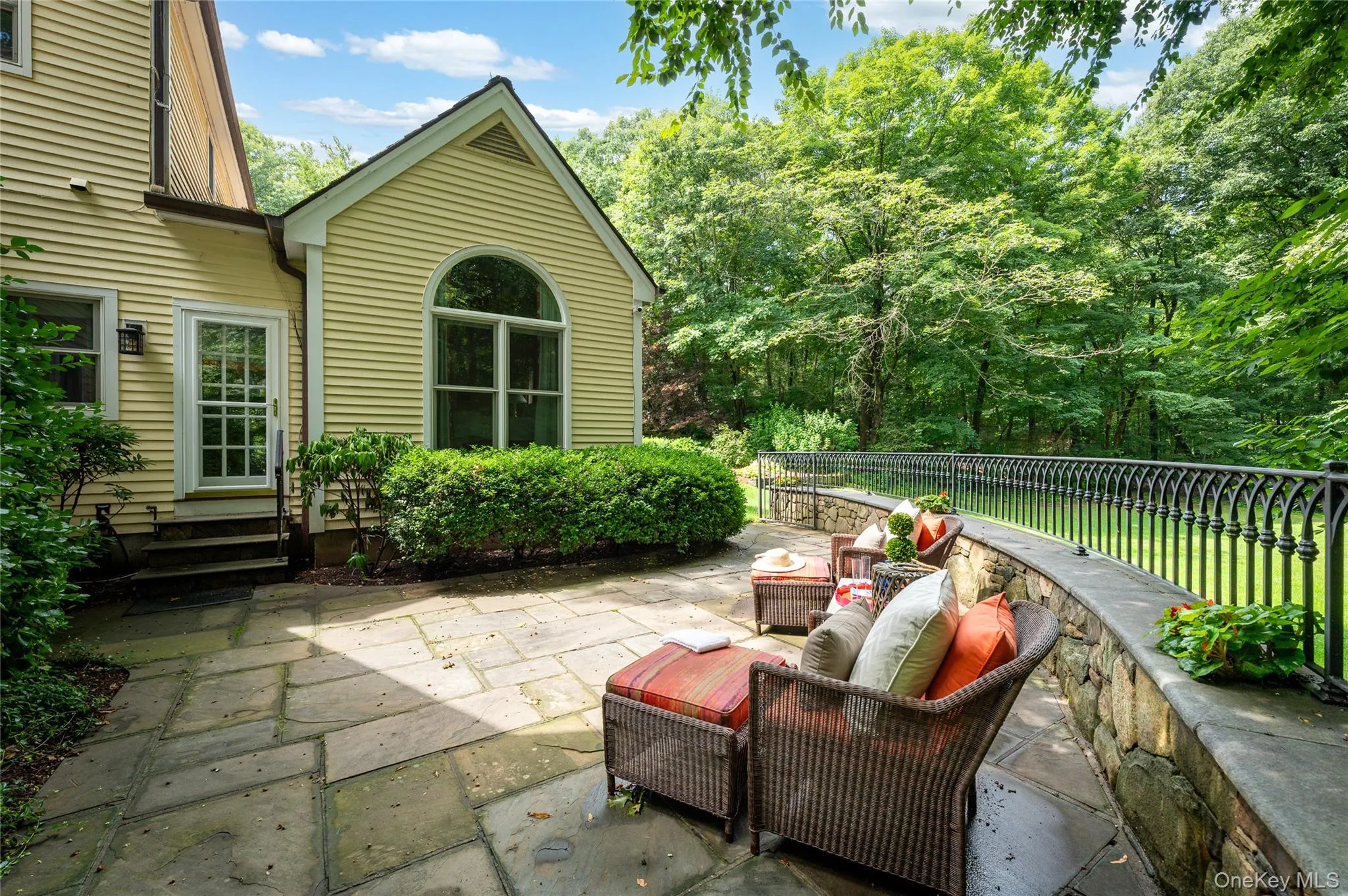 Side patio, fenced, accessed from primary bedroom and formal living room. View of flat useable land. Side patio, fenced, accessed from primary bedroom and formal living room. View of flat useable land.