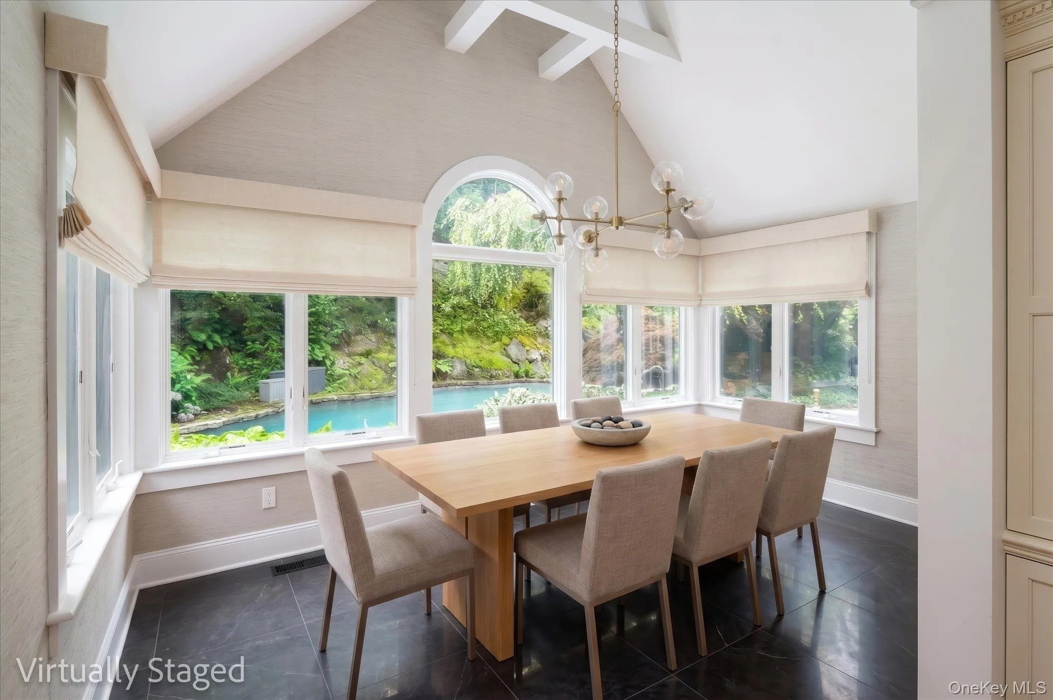 Virtually stage for inspiration. View of solarium vaulted ceiling and beams and view of pool. Virtually stage for inspiration. View of solarium vaulted ceiling and beams and view of pool.