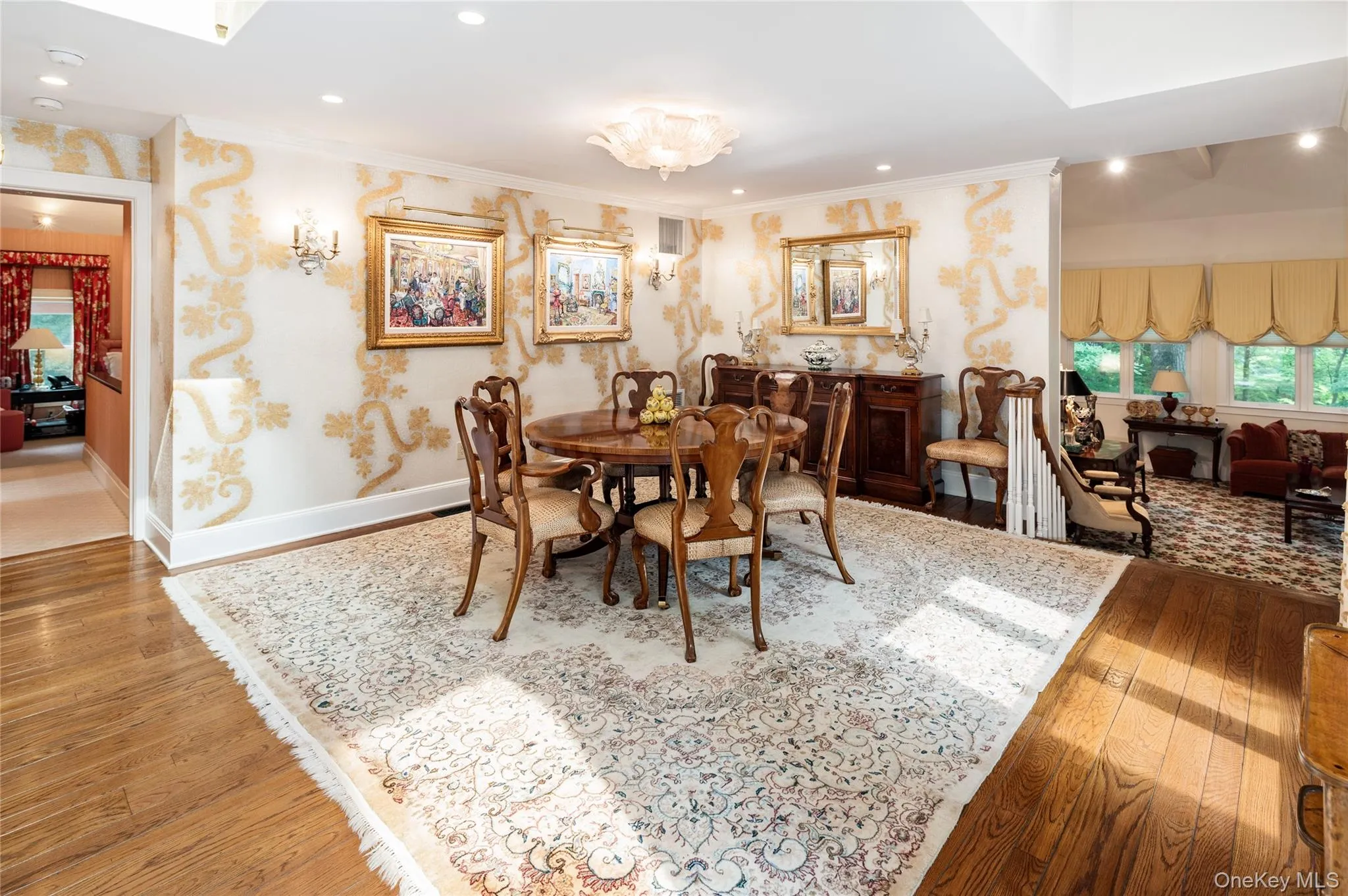 Formal dining room with skylights and view to formal living room and the primary ensuite. Formal dining room with skylights and view to formal living room and the primary ensuite.