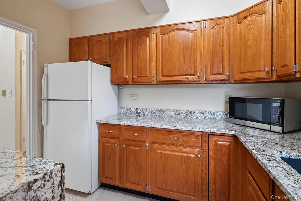 Spacious kitchen with granite counters & plenty of cabinet space Spacious kitchen with granite counters & plenty of cabinet space