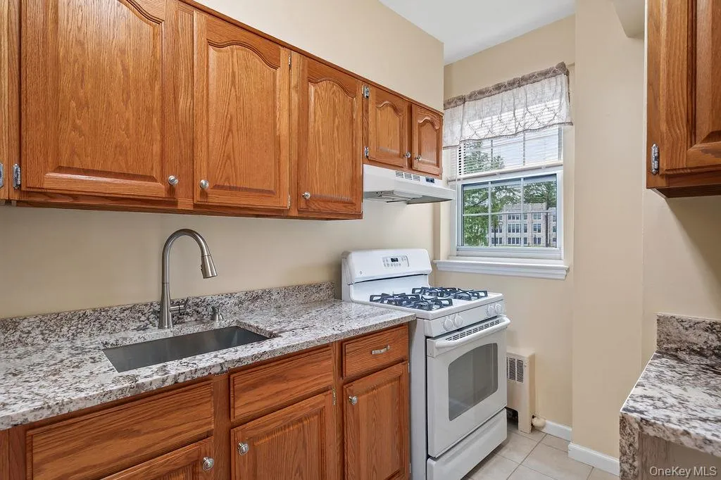 Another view of spacious kitchen with a window to add some natural light Another view of spacious kitchen with a window to add some natural light