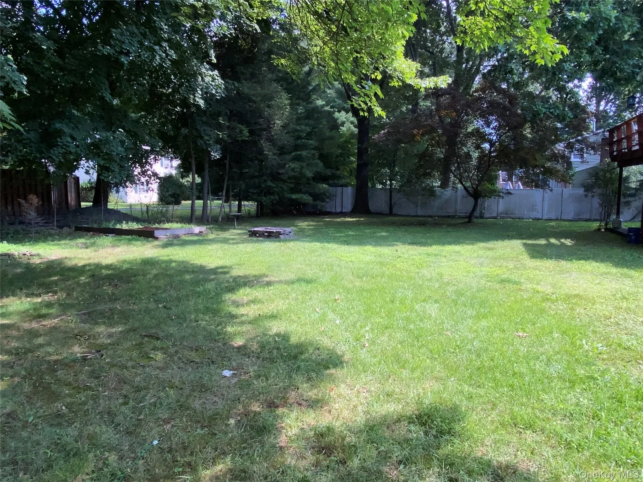 Spacious wide open private flat backyard with wooden swing and room for a pool or possibly even a pickleball court Spacious wide open private flat backyard with wooden swing and room for a pool or possibly even a pickleball court