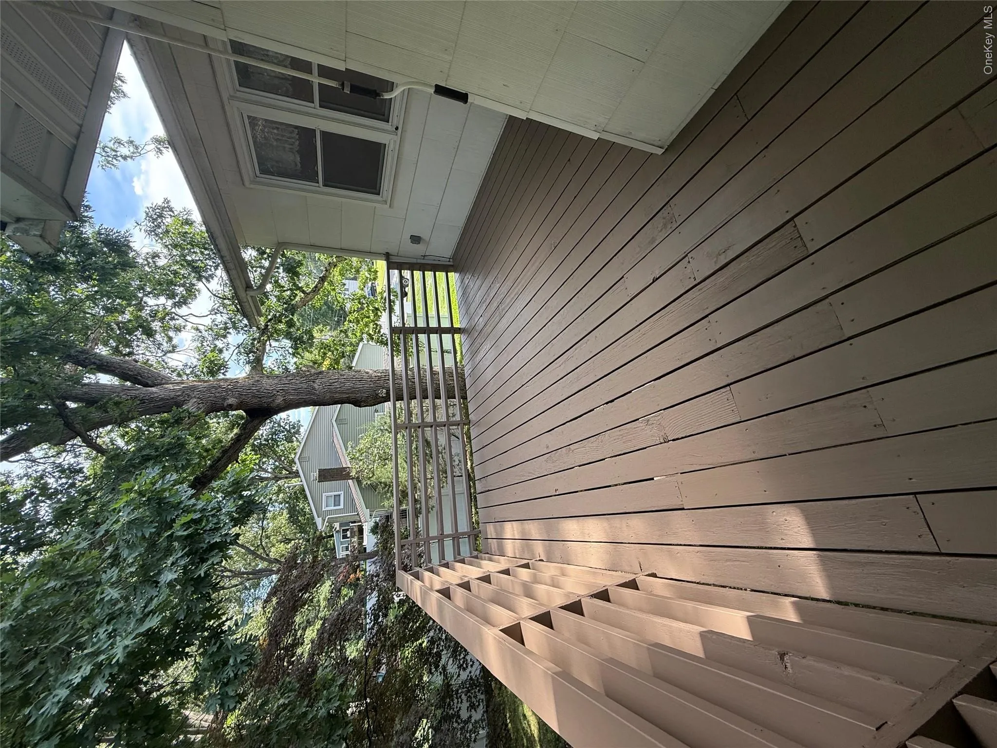 Enjoy barbecues on the with retractable awning conveniently located right outside kitchen with steps to lower level Enjoy barbecues on the with retractable awning conveniently located right outside kitchen with steps to lower level