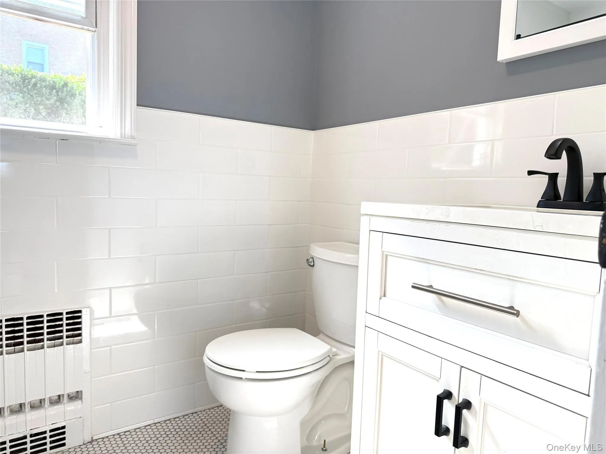Beautifully renovated bathroom with modern finishes, stylish fixtures, and a fresh contemporary feel. Beautifully renovated bathroom with modern finishes, stylish fixtures, and a fresh contemporary feel.