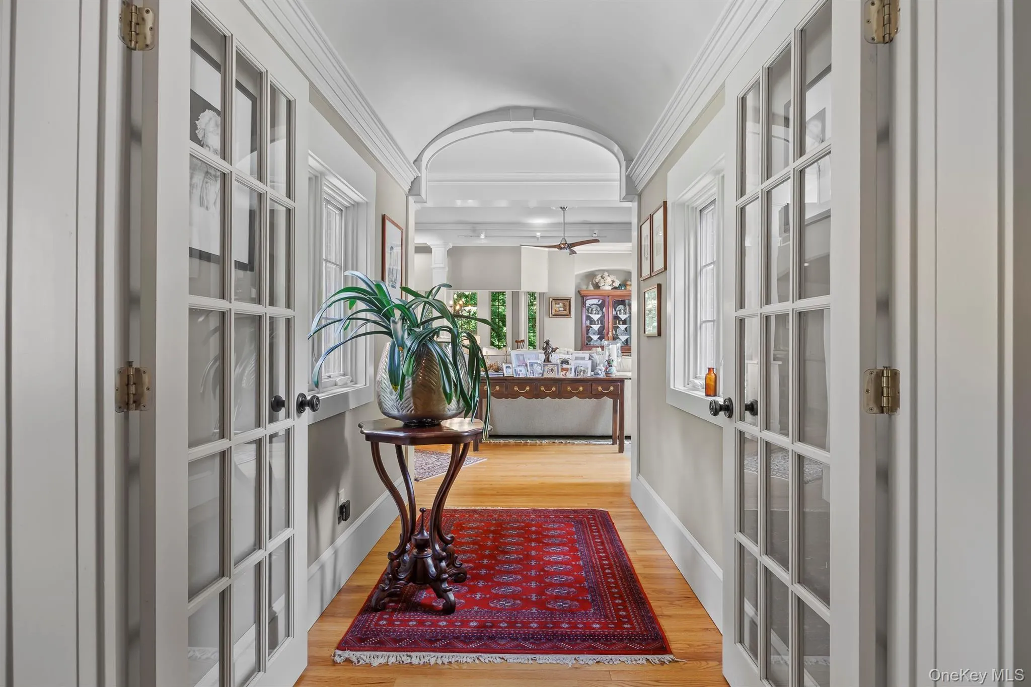 An elegant hallway leads from the foyer into the newer addition An elegant hallway leads from the foyer into the newer addition