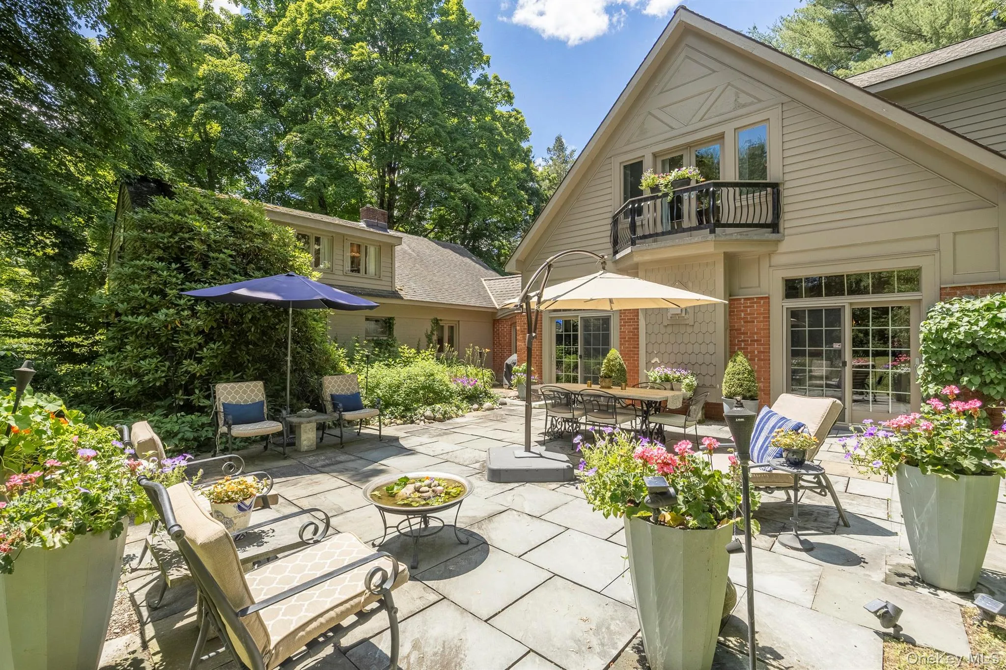A large 650 sq ft stone patio is one of multiple outdoor entertainment areas A large 650 sq ft stone patio is one of multiple outdoor entertainment areas