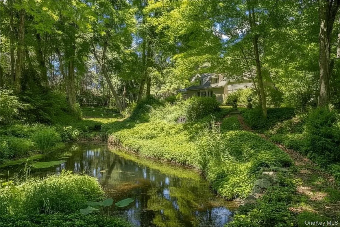 A truly magical entrance includes an exquisite pond with beautiful gardens A truly magical entrance includes an exquisite pond with beautiful gardens