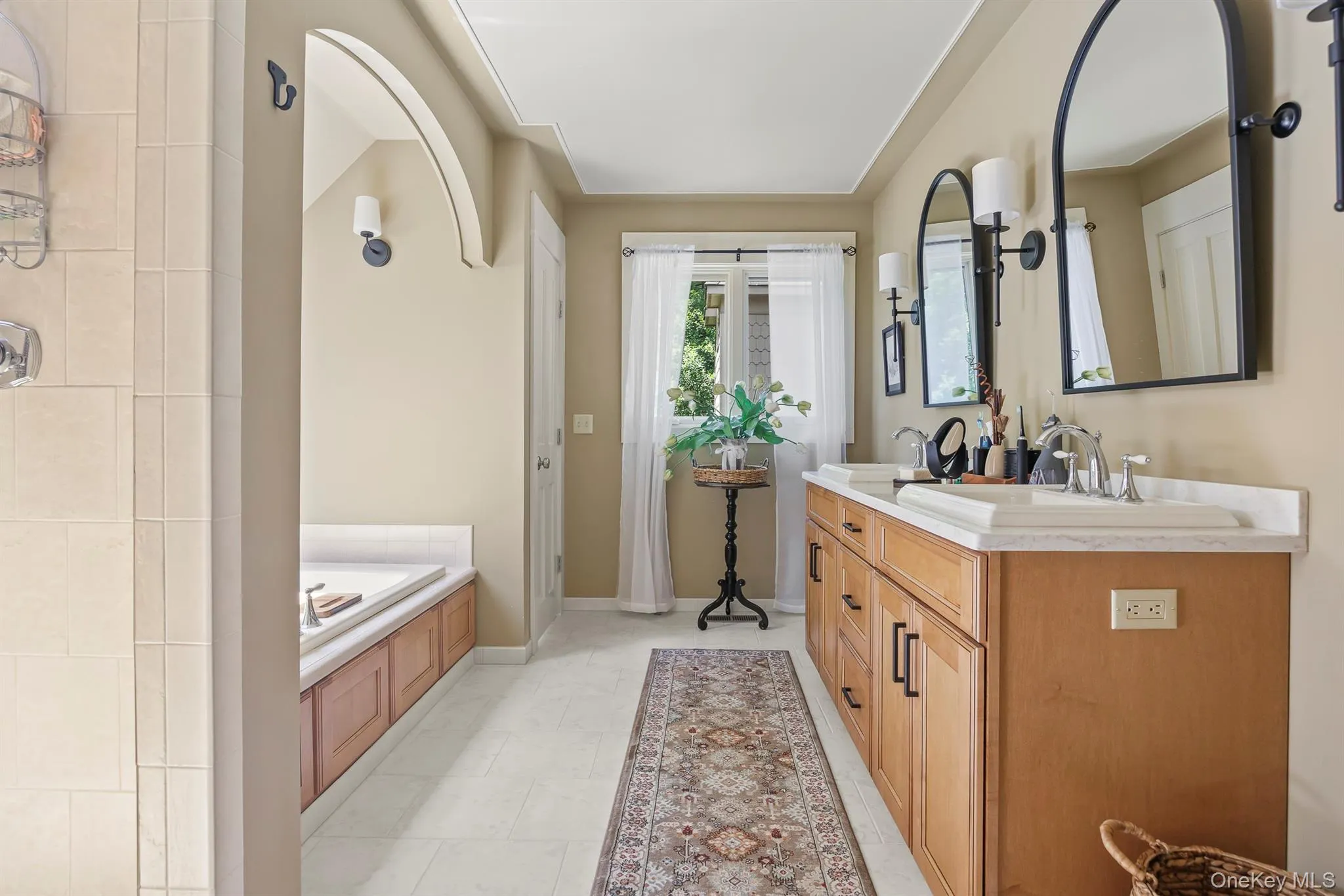 Spacious primary bath with shower and soaking tub is one of 3.5 bathrooms Spacious primary bath with shower and soaking tub is one of 3.5 bathrooms