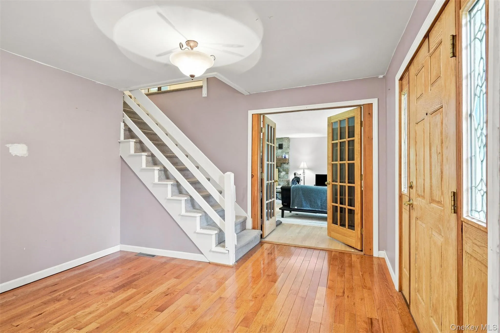Gleaming hardwood floors greet you in the foyer and continue into dining room Gleaming hardwood floors greet you in the foyer and continue into dining room