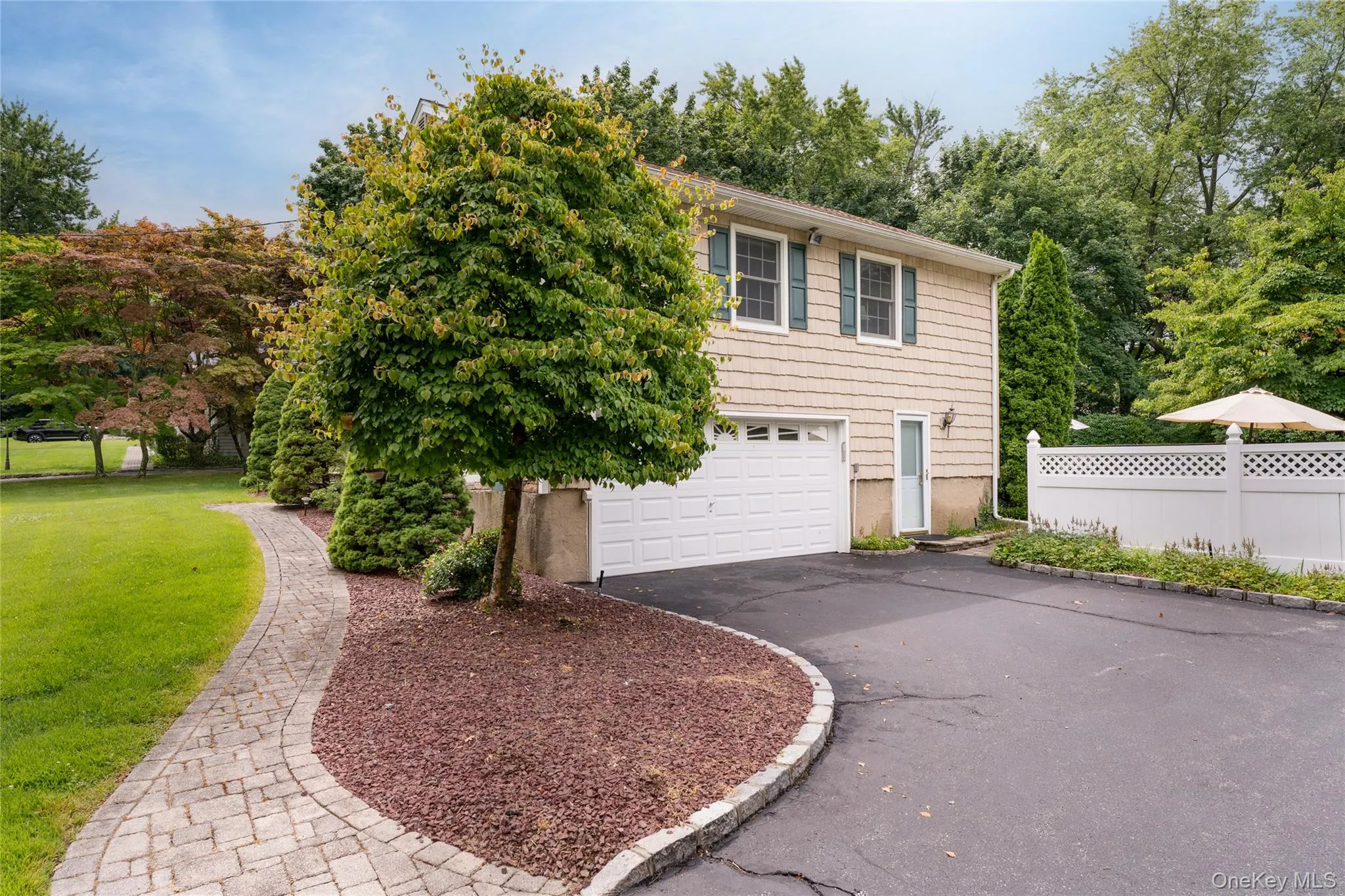 Hidden view garage entry, Belgian block lined driveway, ample parking, outside entry to den Hidden view garage entry, Belgian block lined driveway, ample parking, outside entry to den