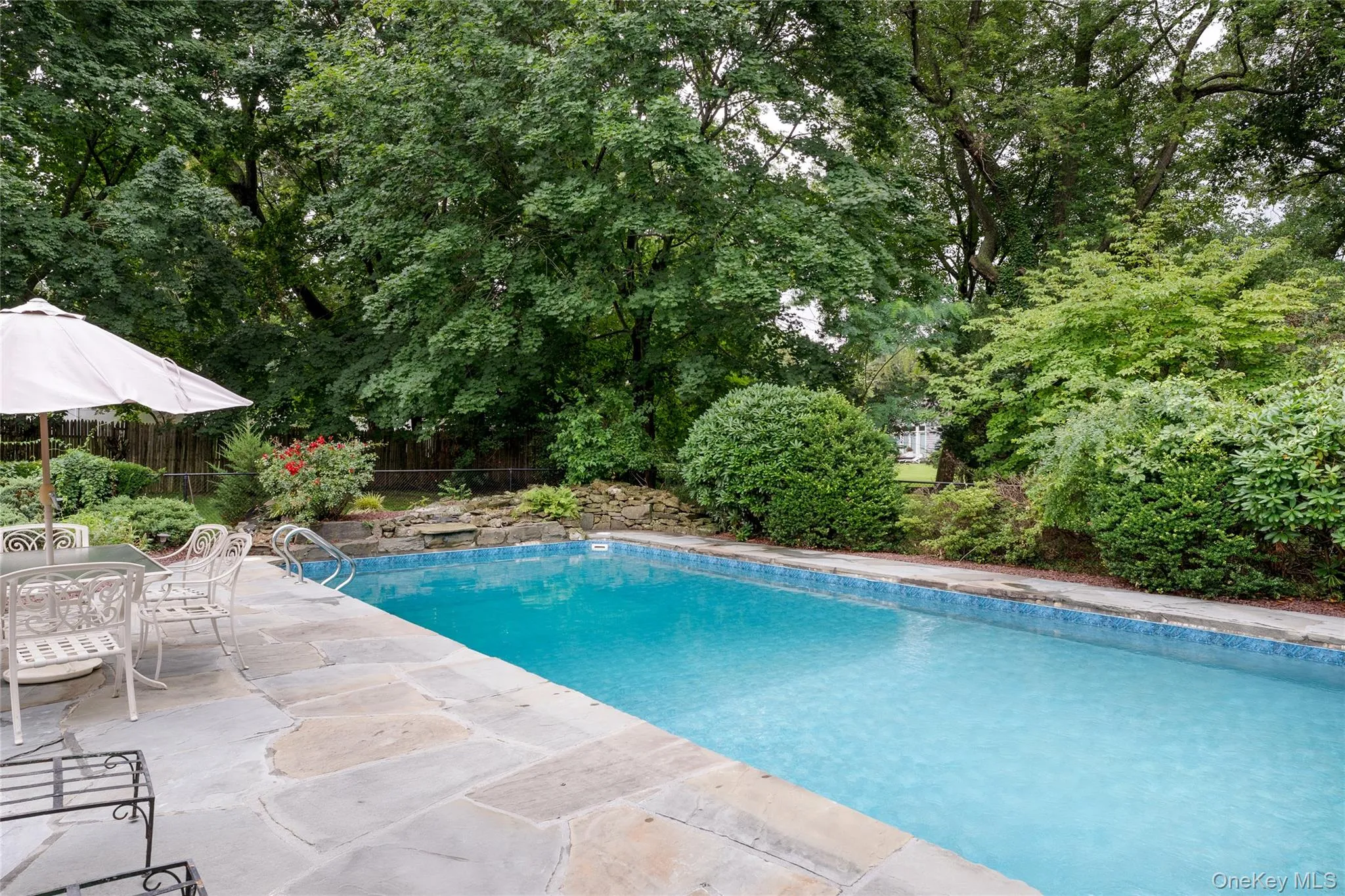 Pool waterfall, chlorine filter, new liner, bluestone patio Pool waterfall, chlorine filter, new liner, bluestone patio