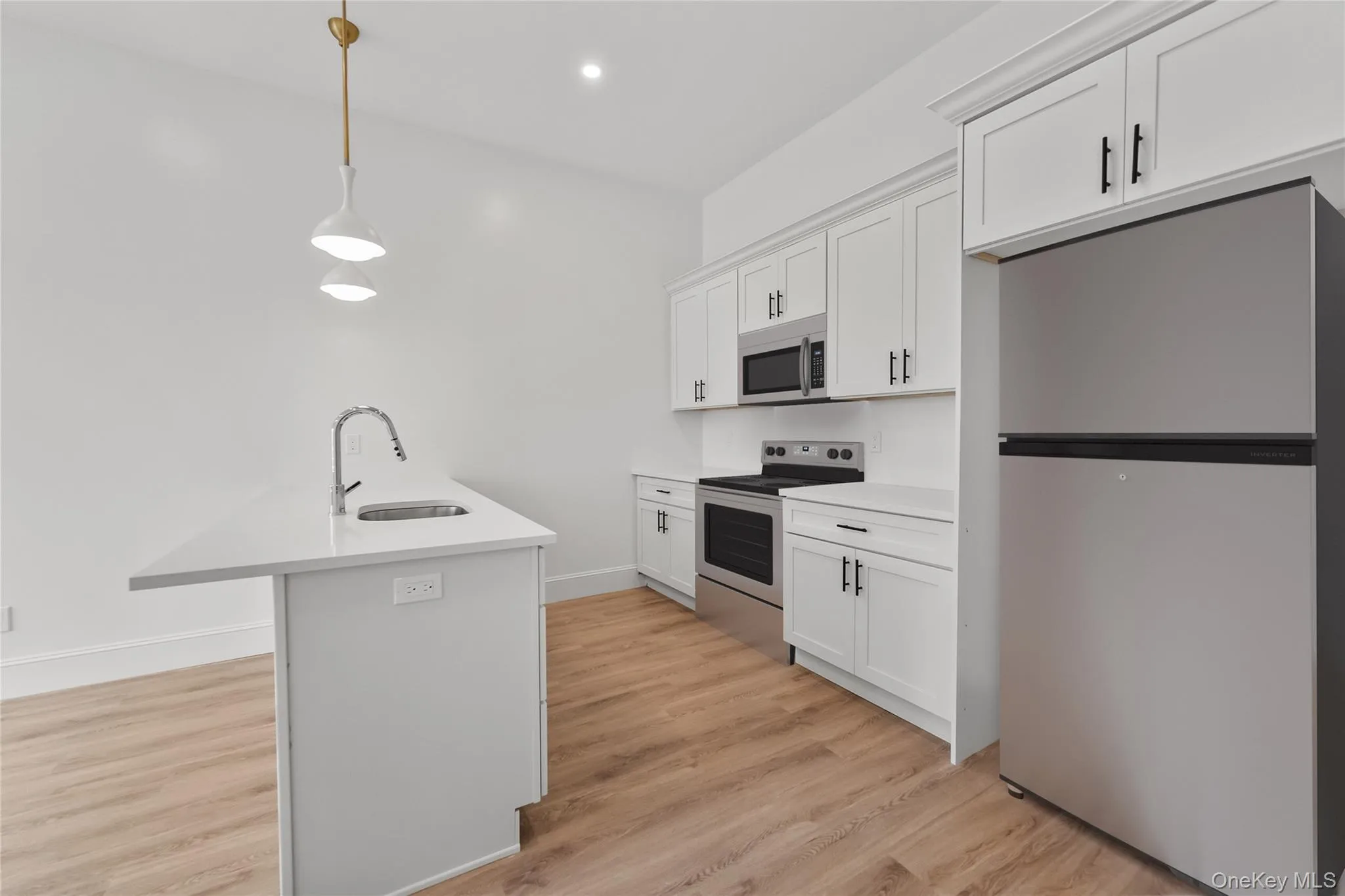 Kitchen with a large Island and stainless steel appliances Kitchen with a large Island and stainless steel appliances