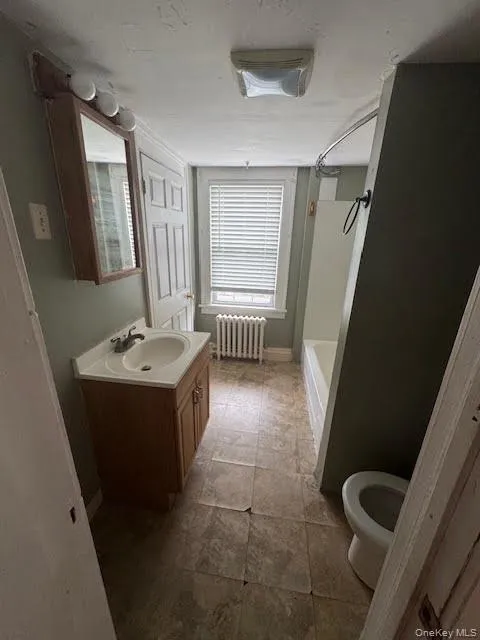 Full bathroom. (Floors are being replaced & updated) Full bathroom. (Floors are being replaced & updated)