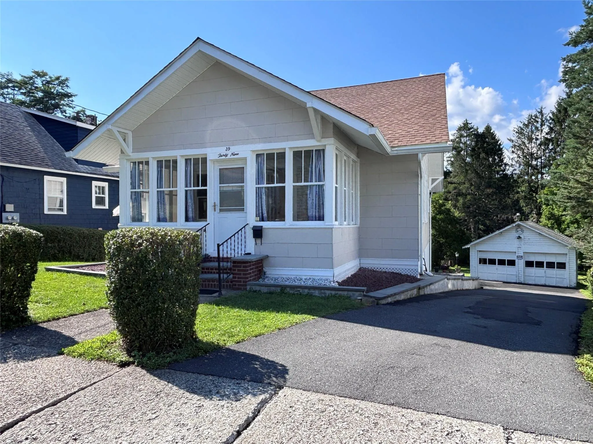 Long driveway with detached garage and ample parking. Long driveway with detached garage and ample parking.