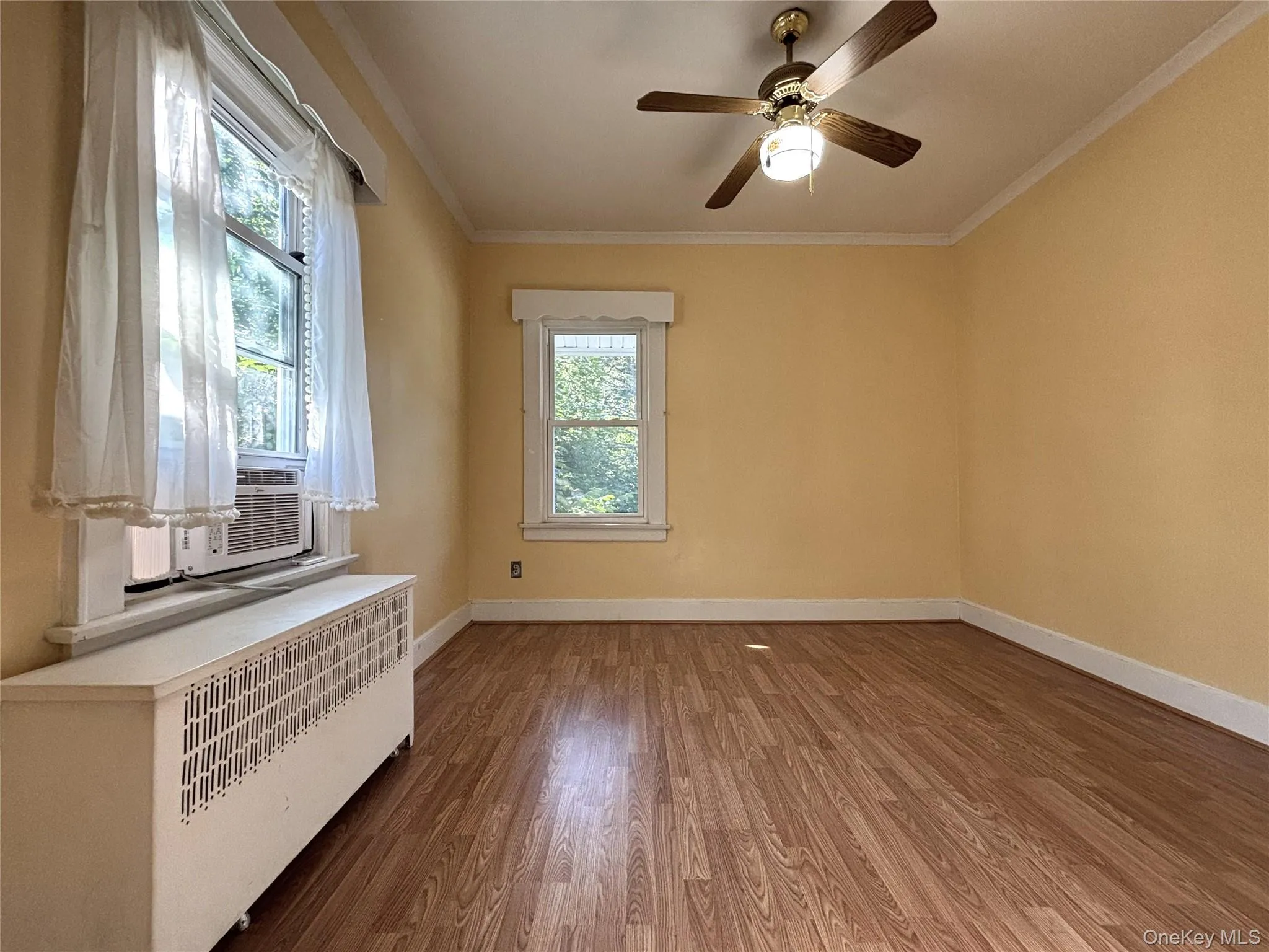 Comfortable primary bedroom with natural light. Comfortable primary bedroom with natural light.