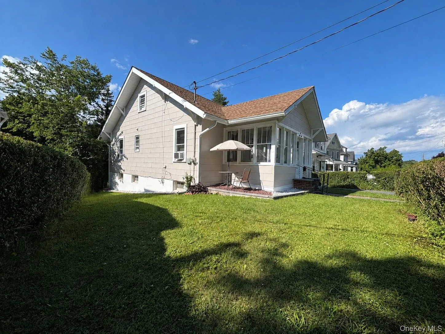Side view featuring mature landscaping for added privacy. Side view featuring mature landscaping for added privacy.