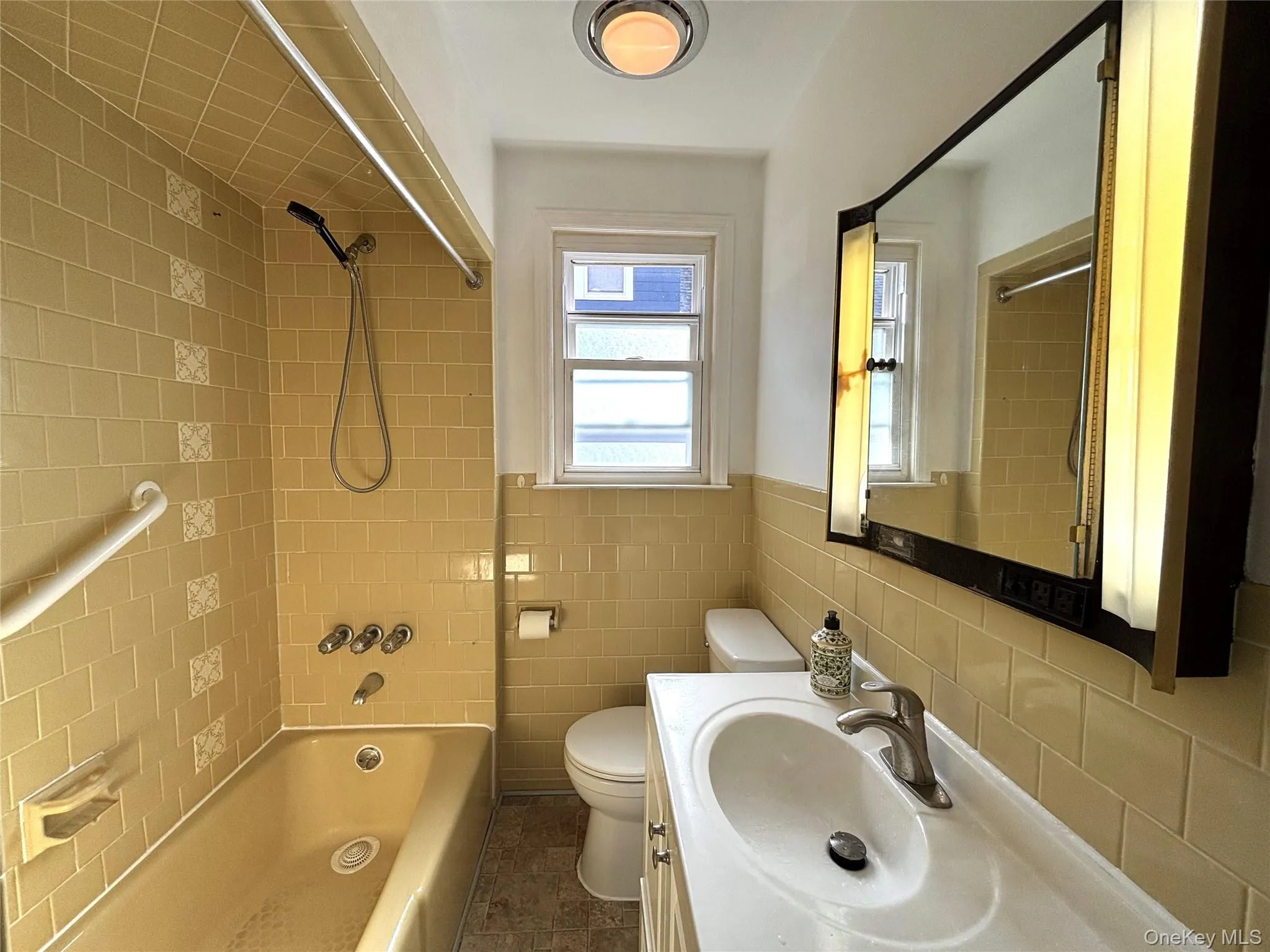 Full bathroom with natural light and ventilation. Full bathroom with natural light and ventilation.