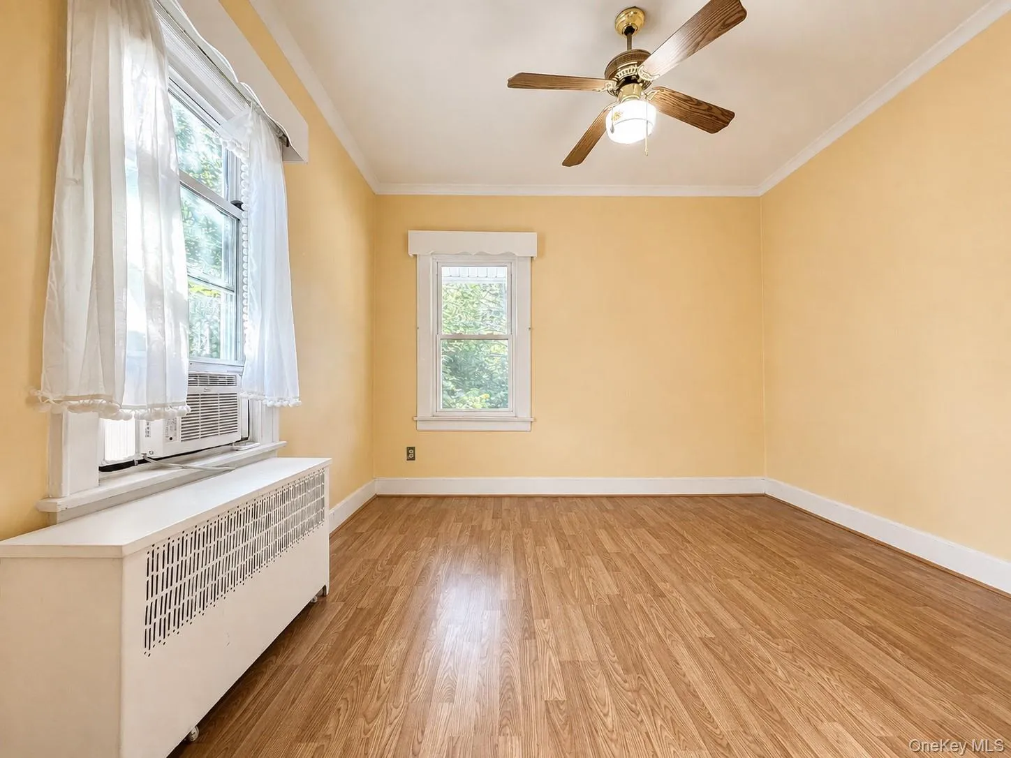 Comfortable primary bedroom with natural light. Comfortable primary bedroom with natural light.