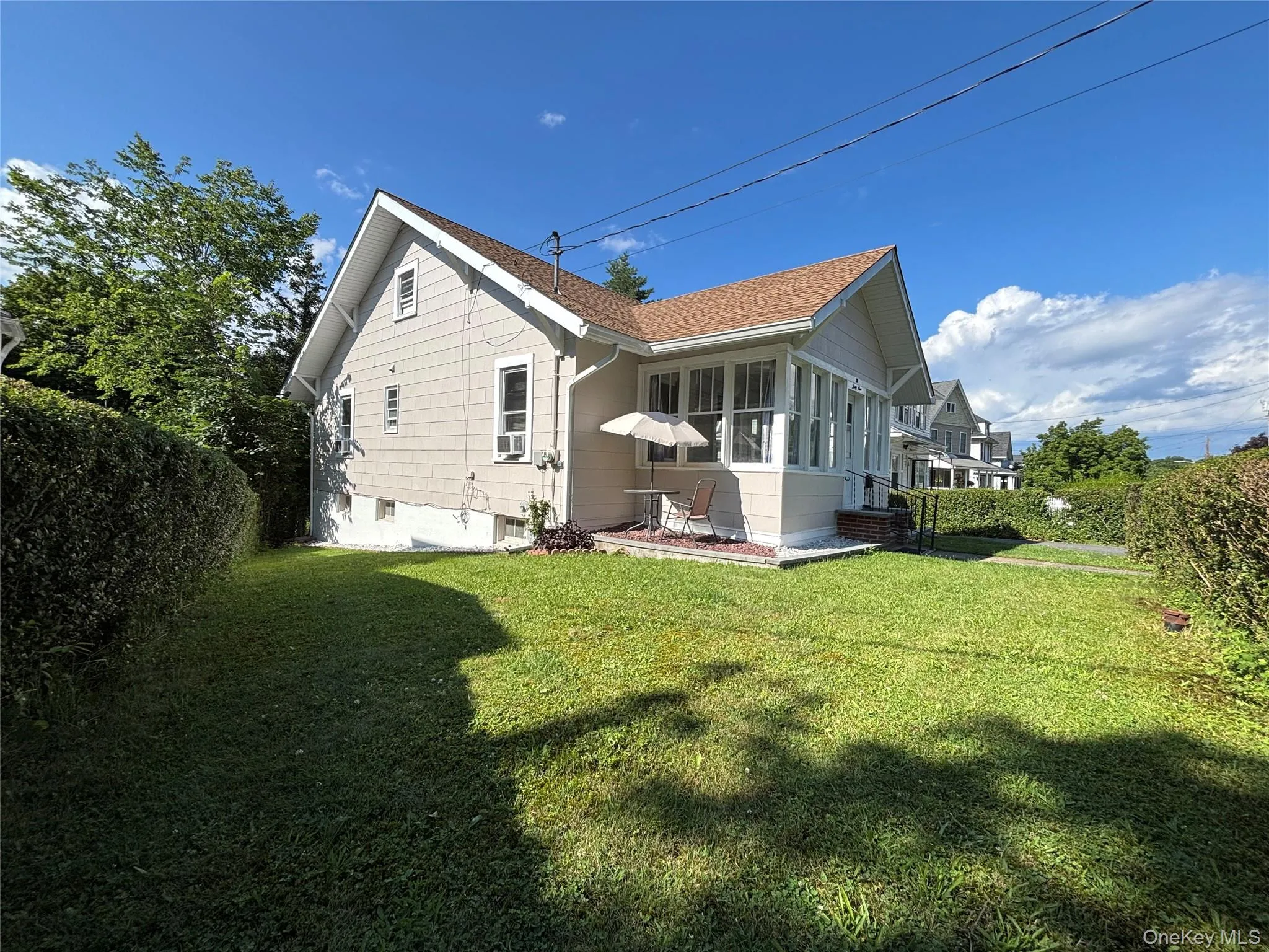 Side view featuring mature landscaping for added privacy. Side view featuring mature landscaping for added privacy.