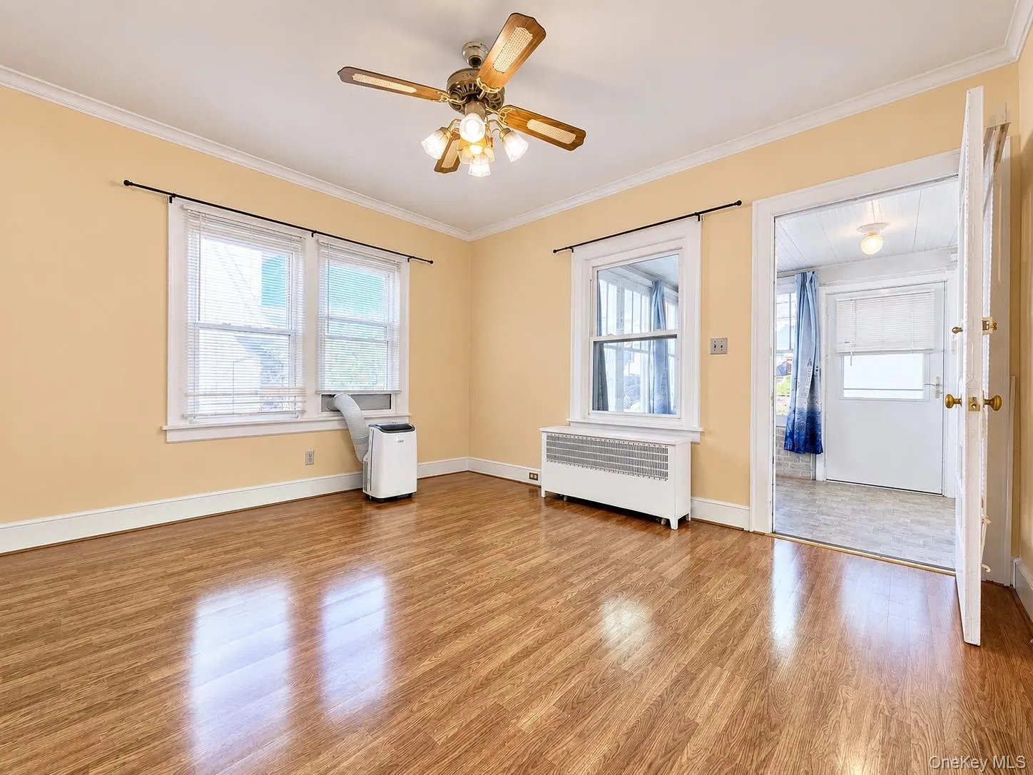 Comfortable living room with abundant natural light. Comfortable living room with abundant natural light.
