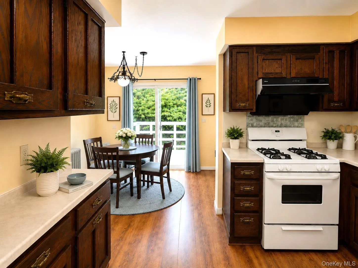 Kitchen with direct access to the rear deck.(Virtual Staged) Kitchen with direct access to the rear deck.(Virtual Staged)