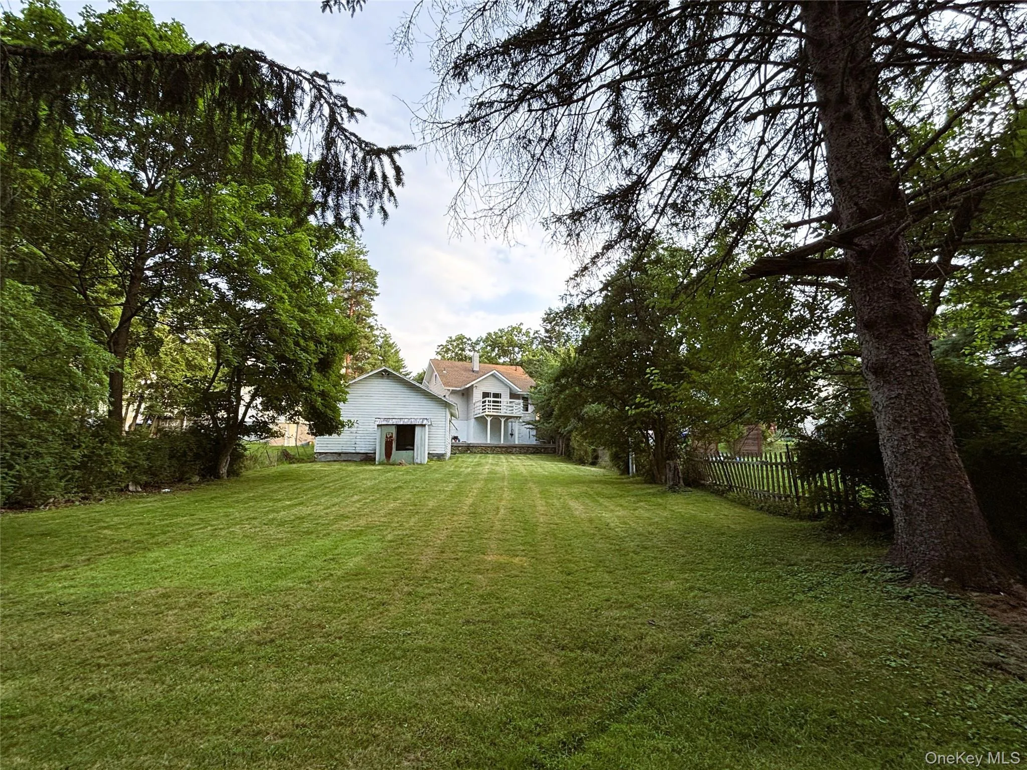 Expansive, level backyard with endless possibilities for outdoor enjoyment. Expansive, level backyard with endless possibilities for outdoor enjoyment.