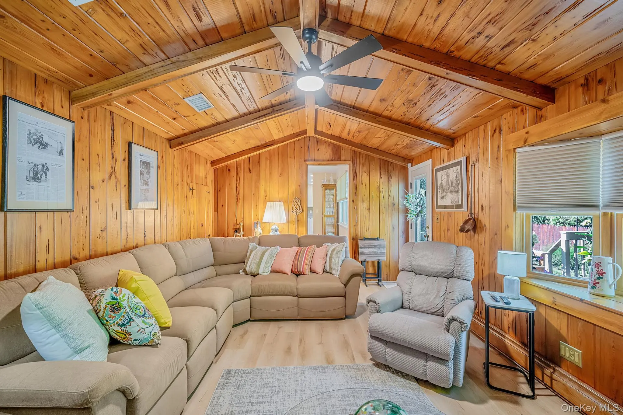 Wood-paneled walls and ceiling with exposed beams Wood-paneled walls and ceiling with exposed beams