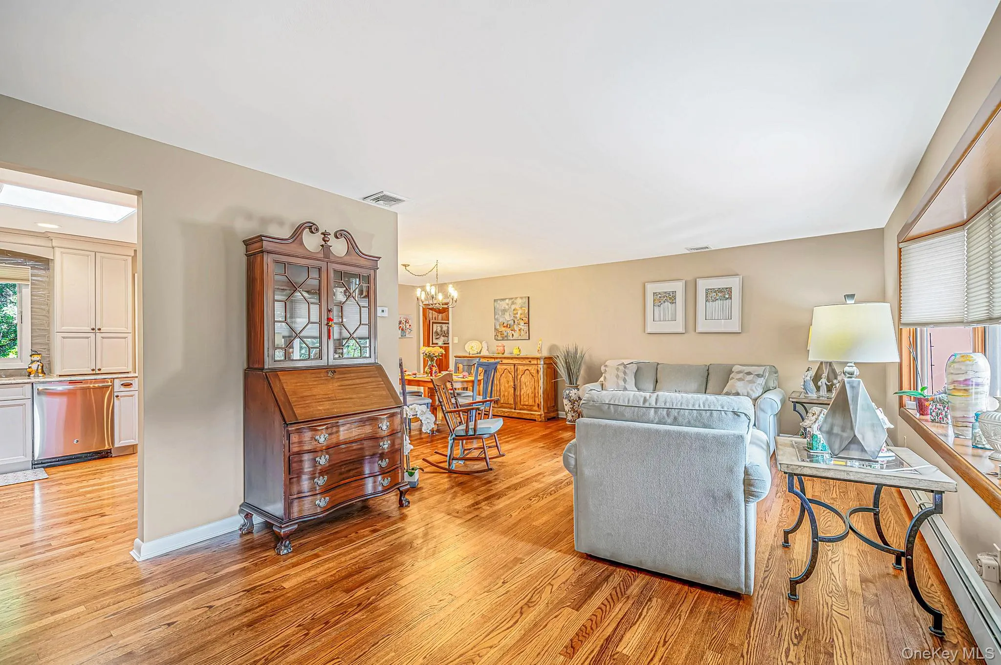 Hardwood flooring, neutral wall tones, recessed lighting, bay window, and a kitchen with stainless steel appliances Hardwood flooring, neutral wall tones, recessed lighting, bay window, and a kitchen with stainless steel appliances