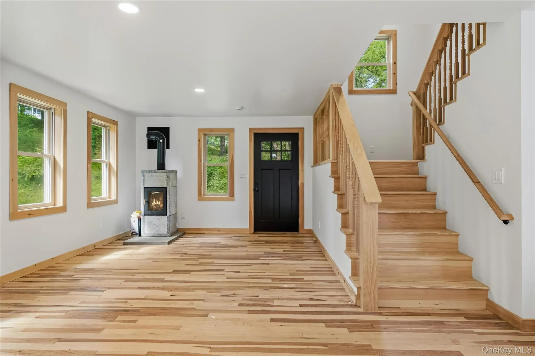 Entry to living room with hickory floors, soapstone stove from Finland Entry to living room with hickory floors, soapstone stove from Finland