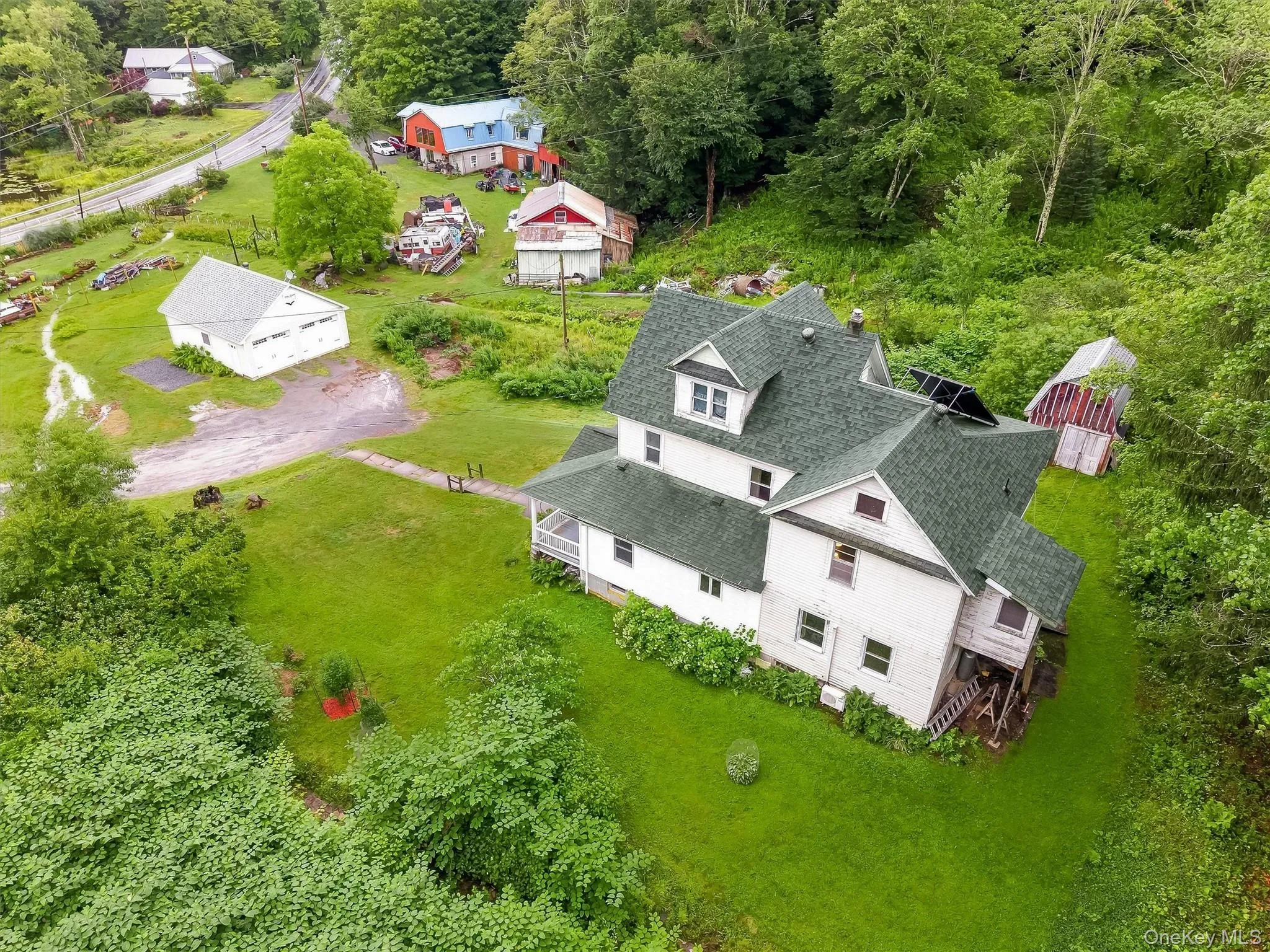 Aerial view of the house & garage Aerial view of the house & garage