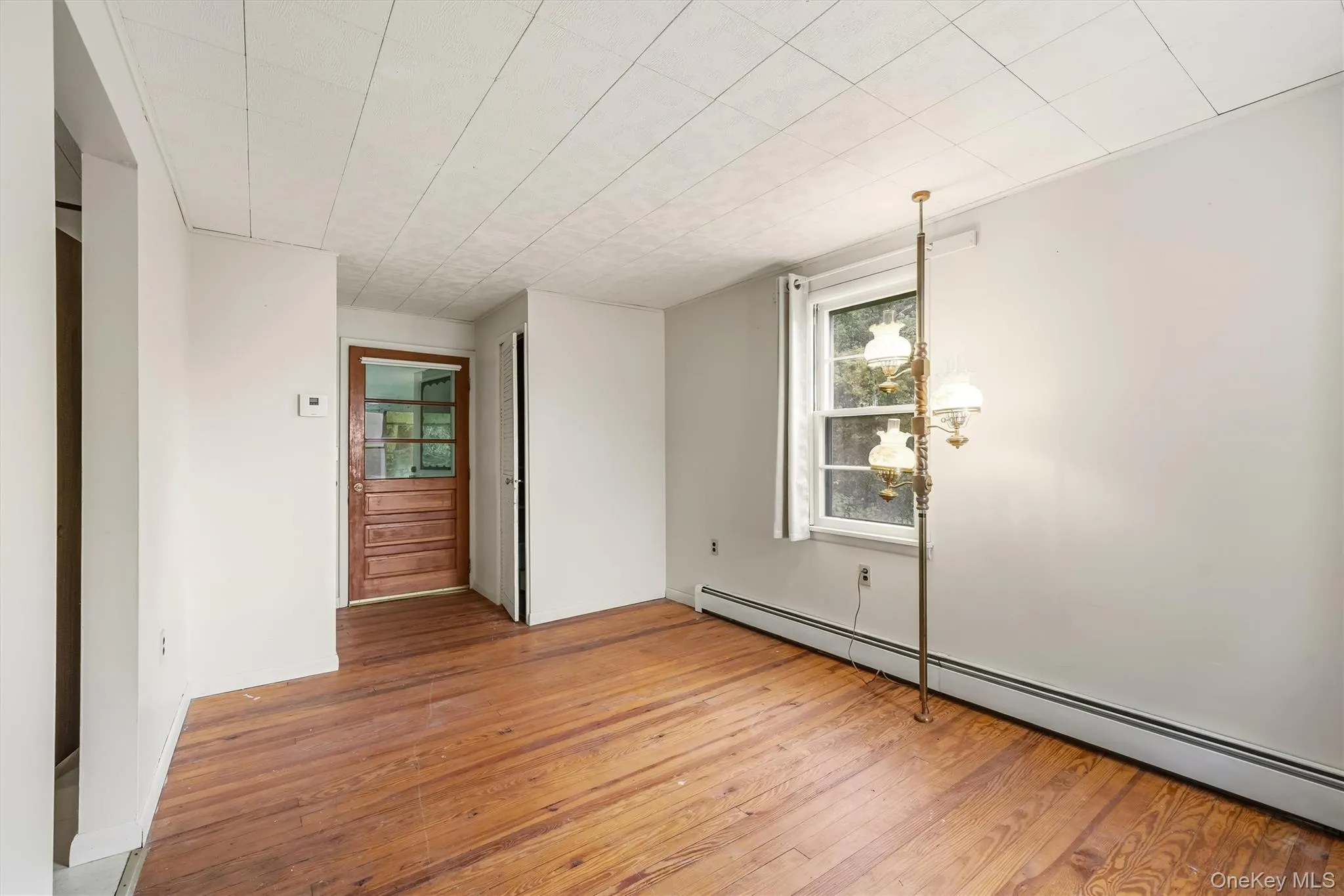Upstairs living room, alternate view, showing back door access to private back step entrance Upstairs living room, alternate view, showing back door access to private back step entrance