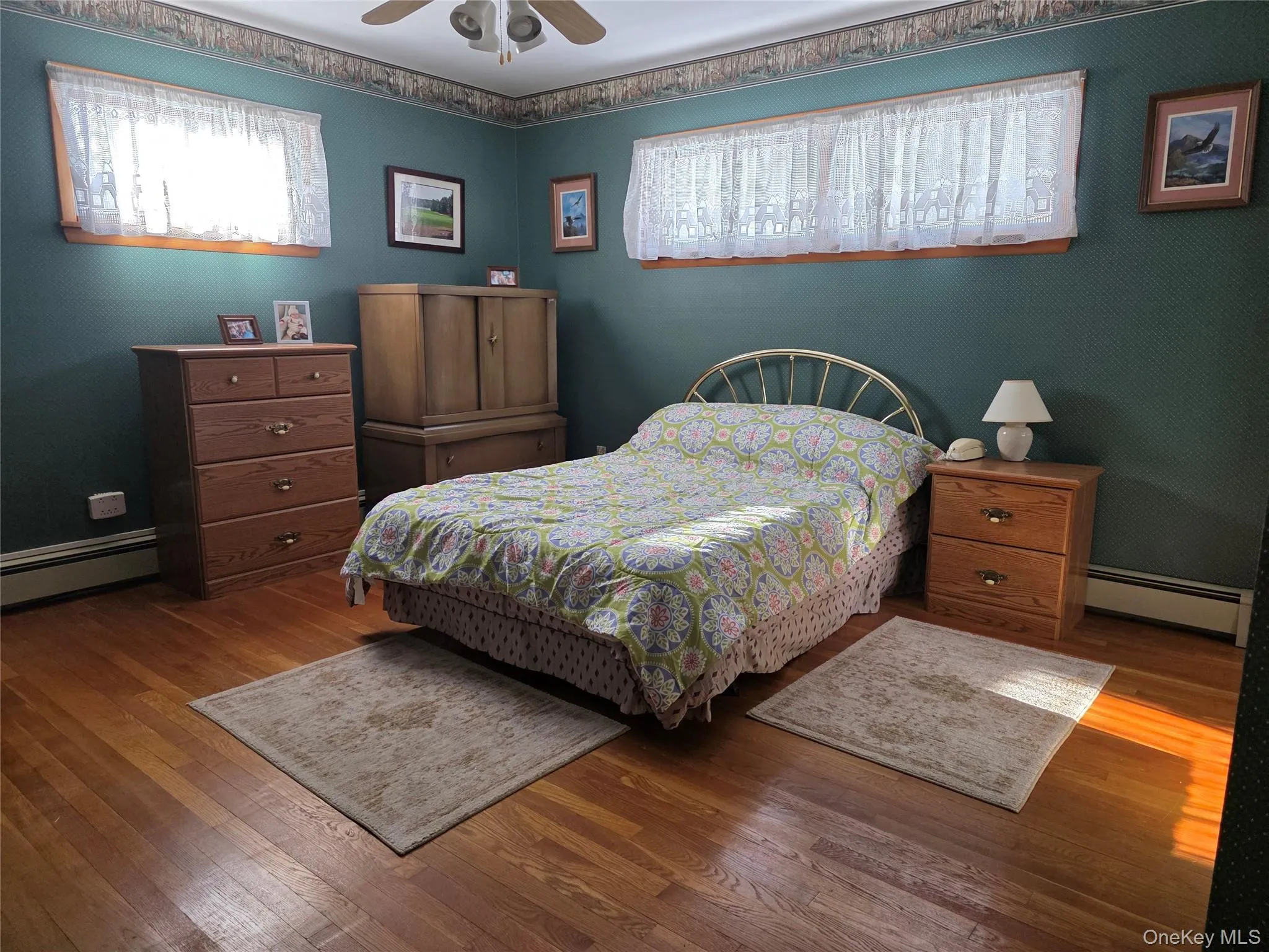 Second Bedroom featuring multiple windows and wood flooring, Second Bedroom featuring multiple windows and wood flooring,