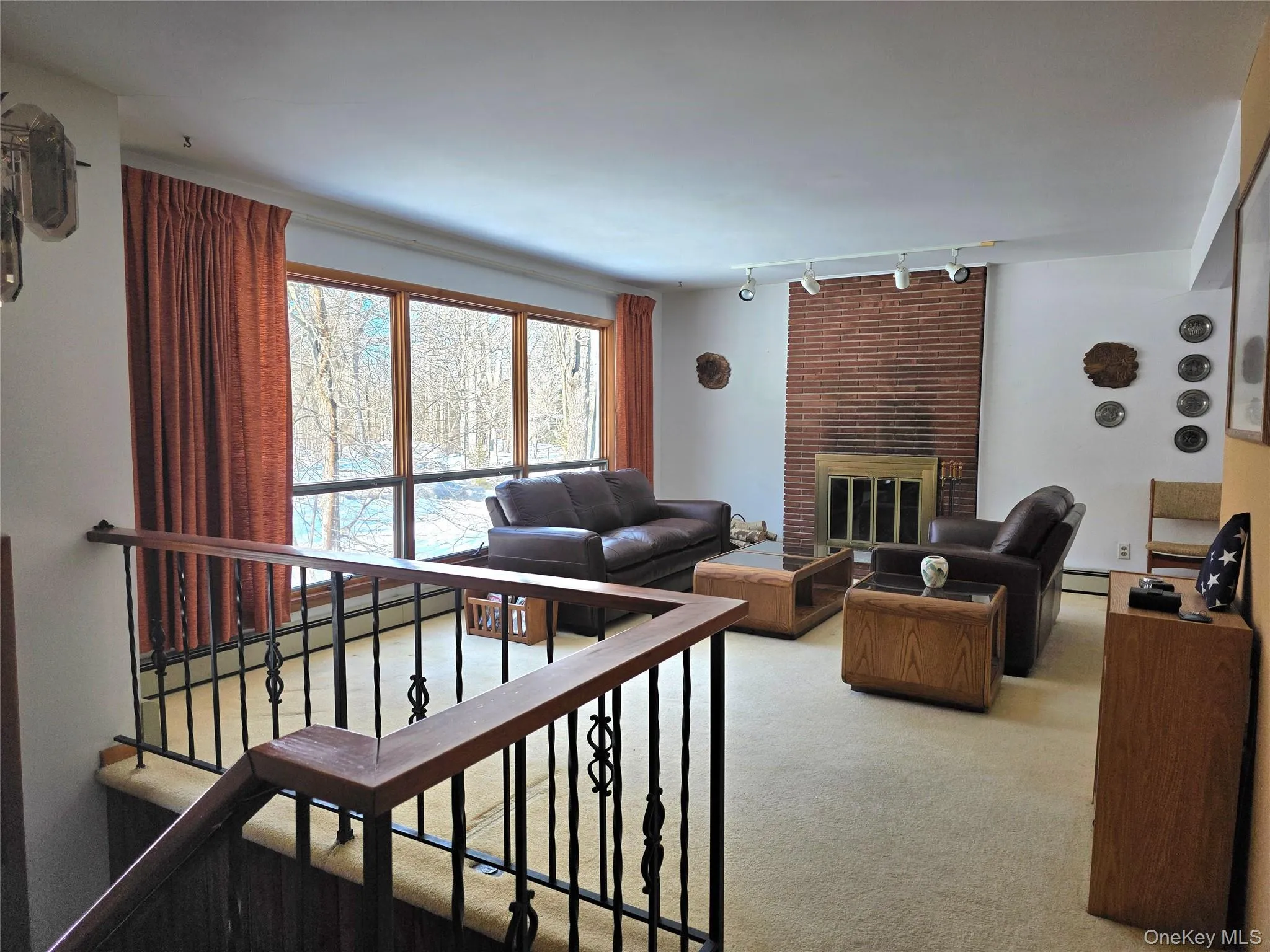 Living room with wood burning brick fireplace Living room with wood burning brick fireplace