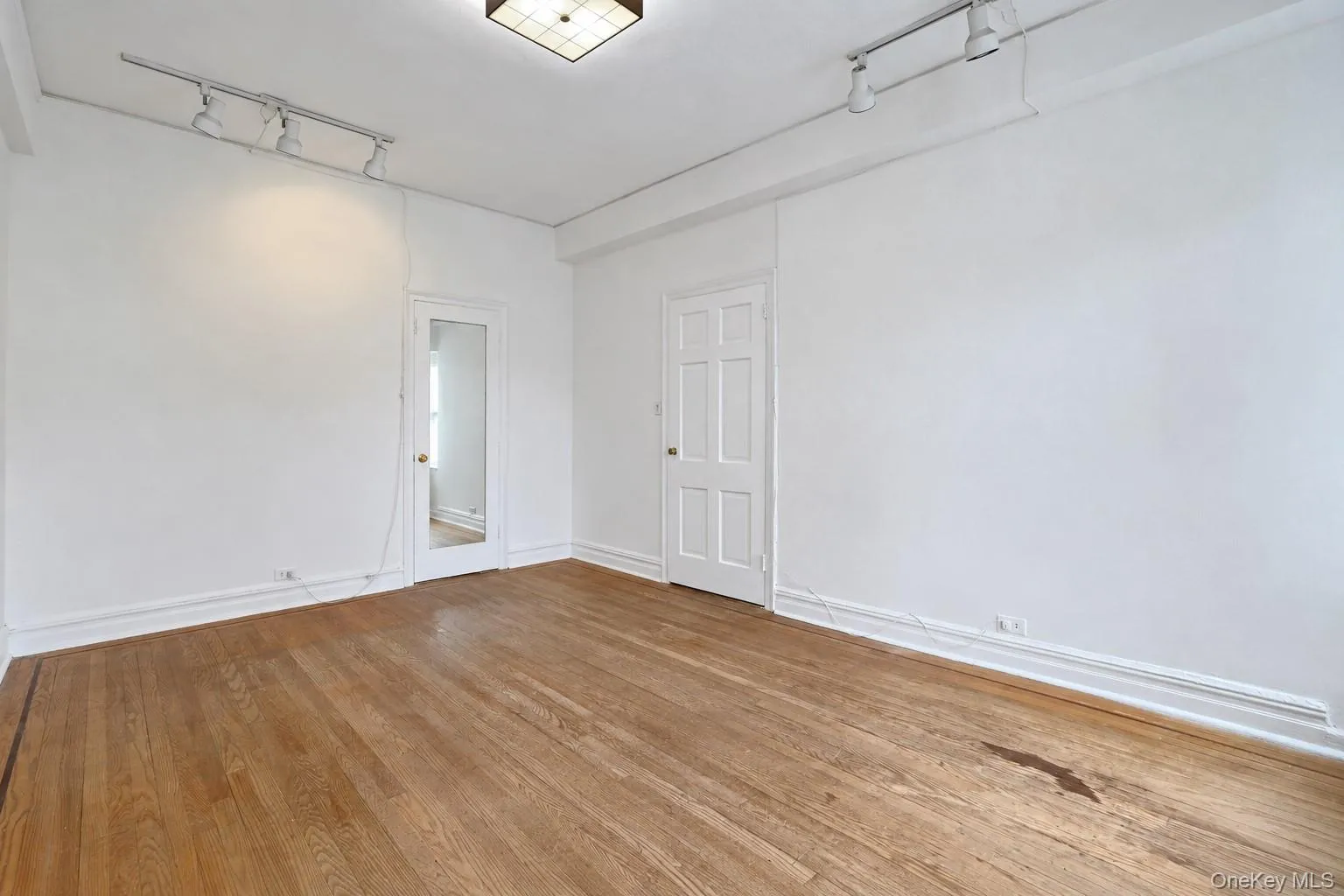 Additional view of the second bedroom highlighting its generous size and natural light. Additional view of the second bedroom highlighting its generous size and natural light.