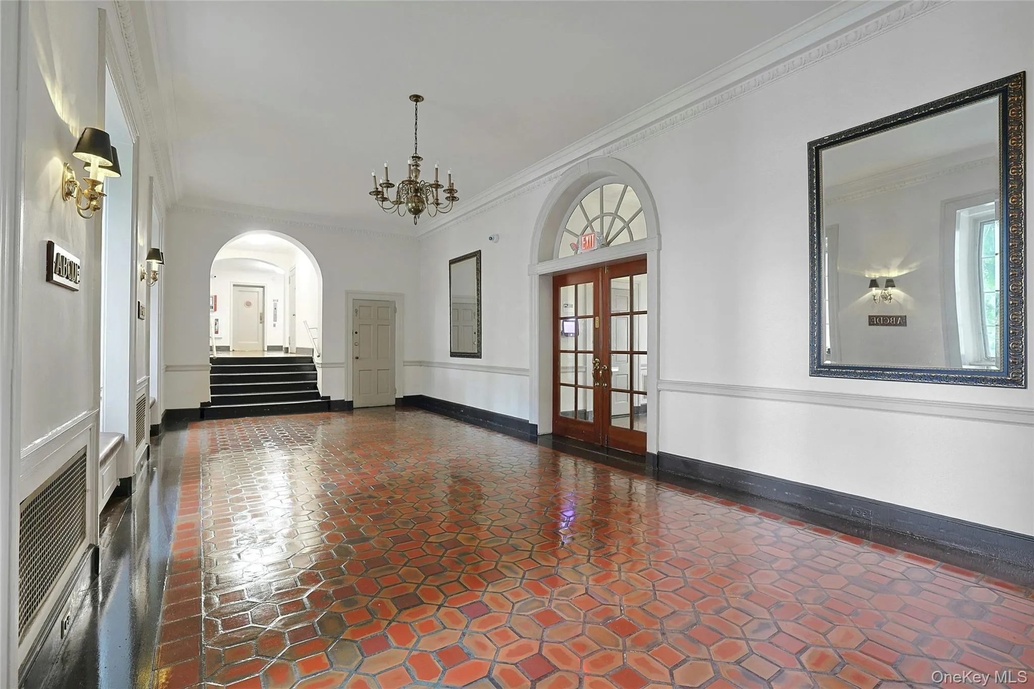 Gracious building lobby featuring distinctive tile flooring, high ceilings, and pre-war character. Gracious building lobby featuring distinctive tile flooring, high ceilings, and pre-war character.