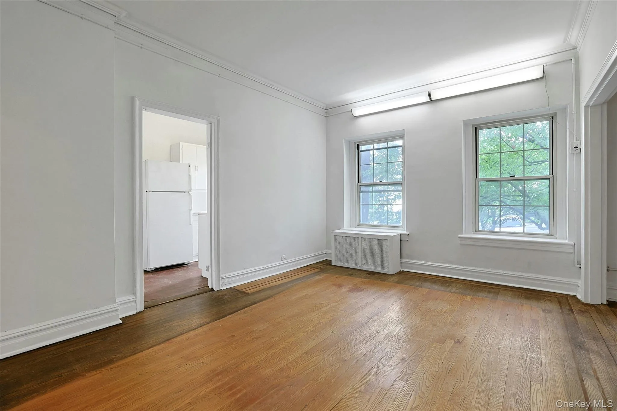 Another view of the sun-filled dining room with multiple exposures and hardwood floors. Another view of the sun-filled dining room with multiple exposures and hardwood floors.