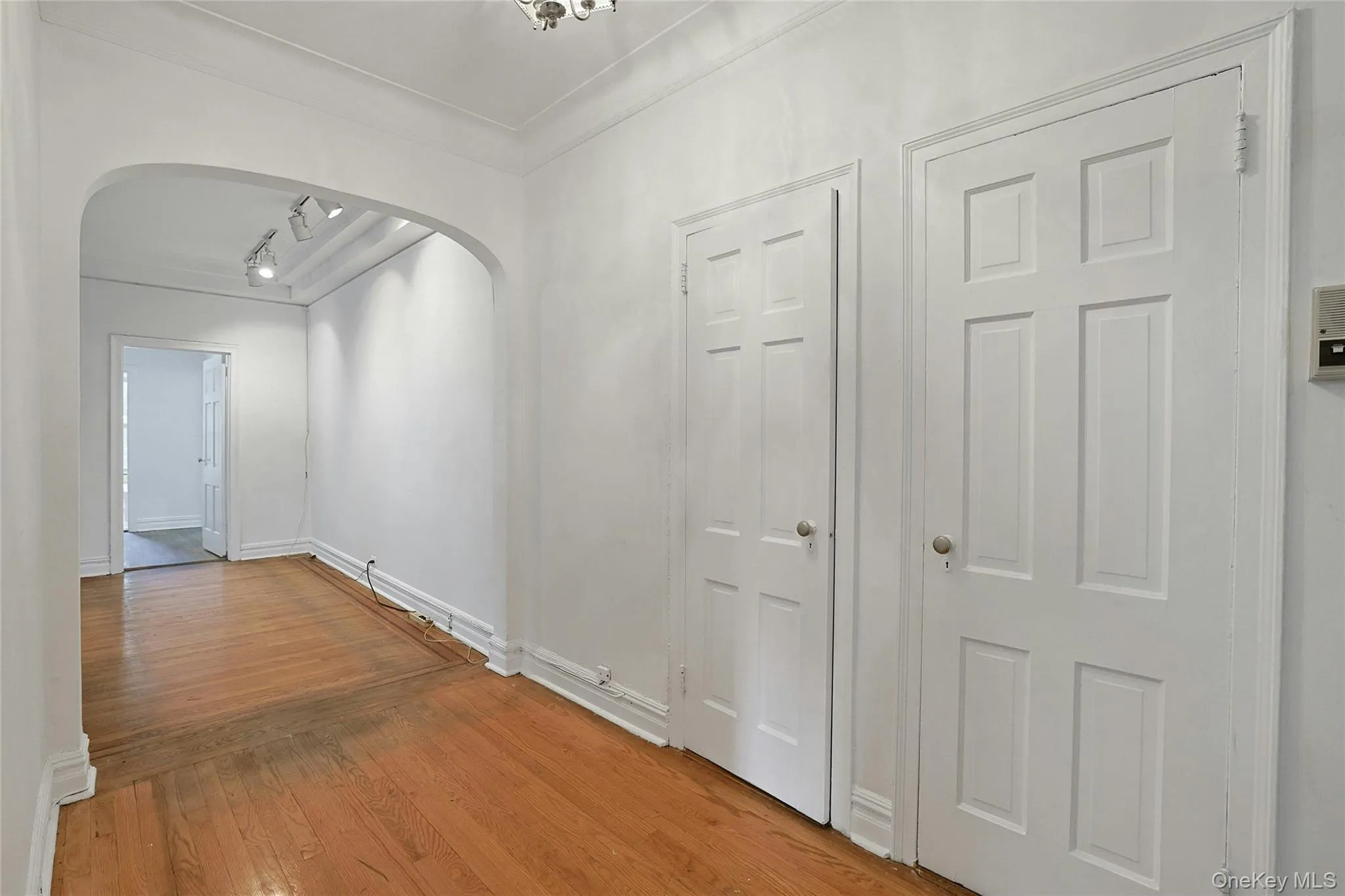 Spacious entry gallery with hardwood floors and an impressive amount of closet storage. Spacious entry gallery with hardwood floors and an impressive amount of closet storage.