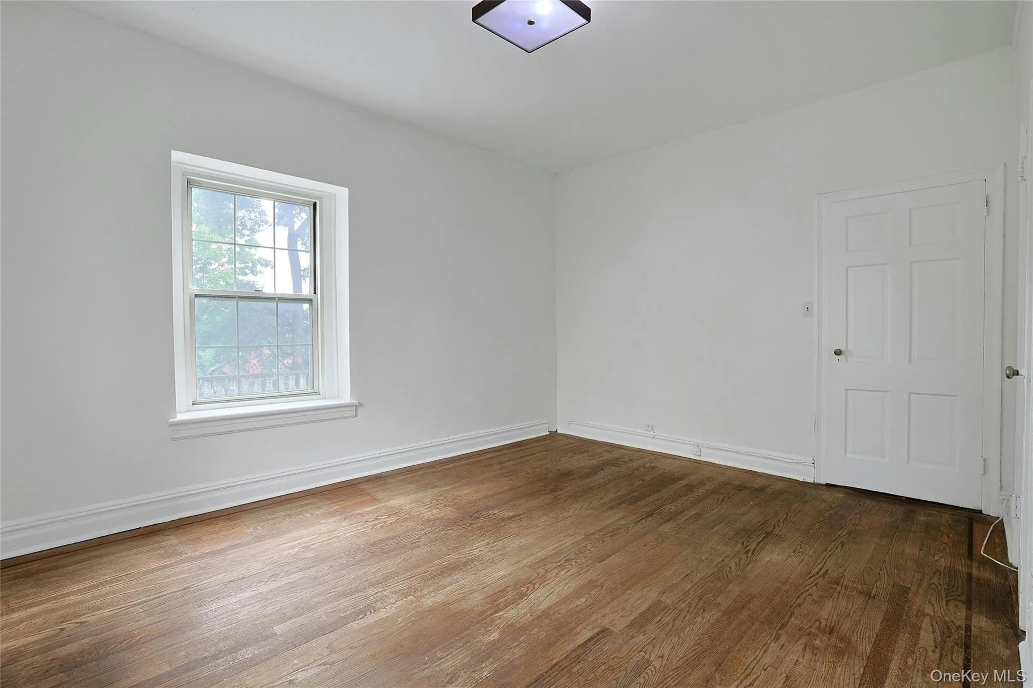 Well-proportioned bedroom with hardwood floors, natural light, and flexible furniture placement. Well-proportioned bedroom with hardwood floors, natural light, and flexible furniture placement.