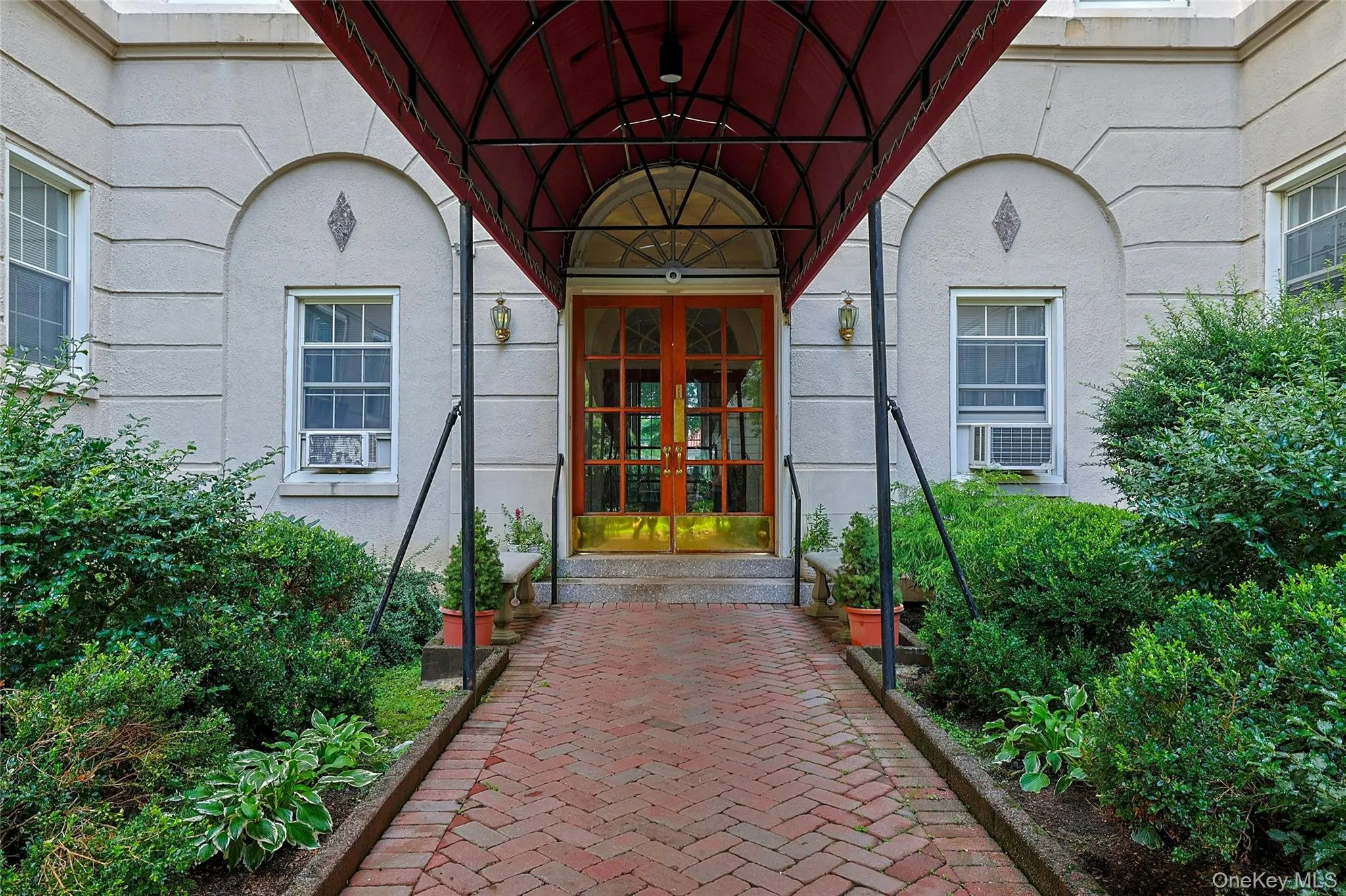Attractive brick walkway leading to the building entrance. Attractive brick walkway leading to the building entrance.