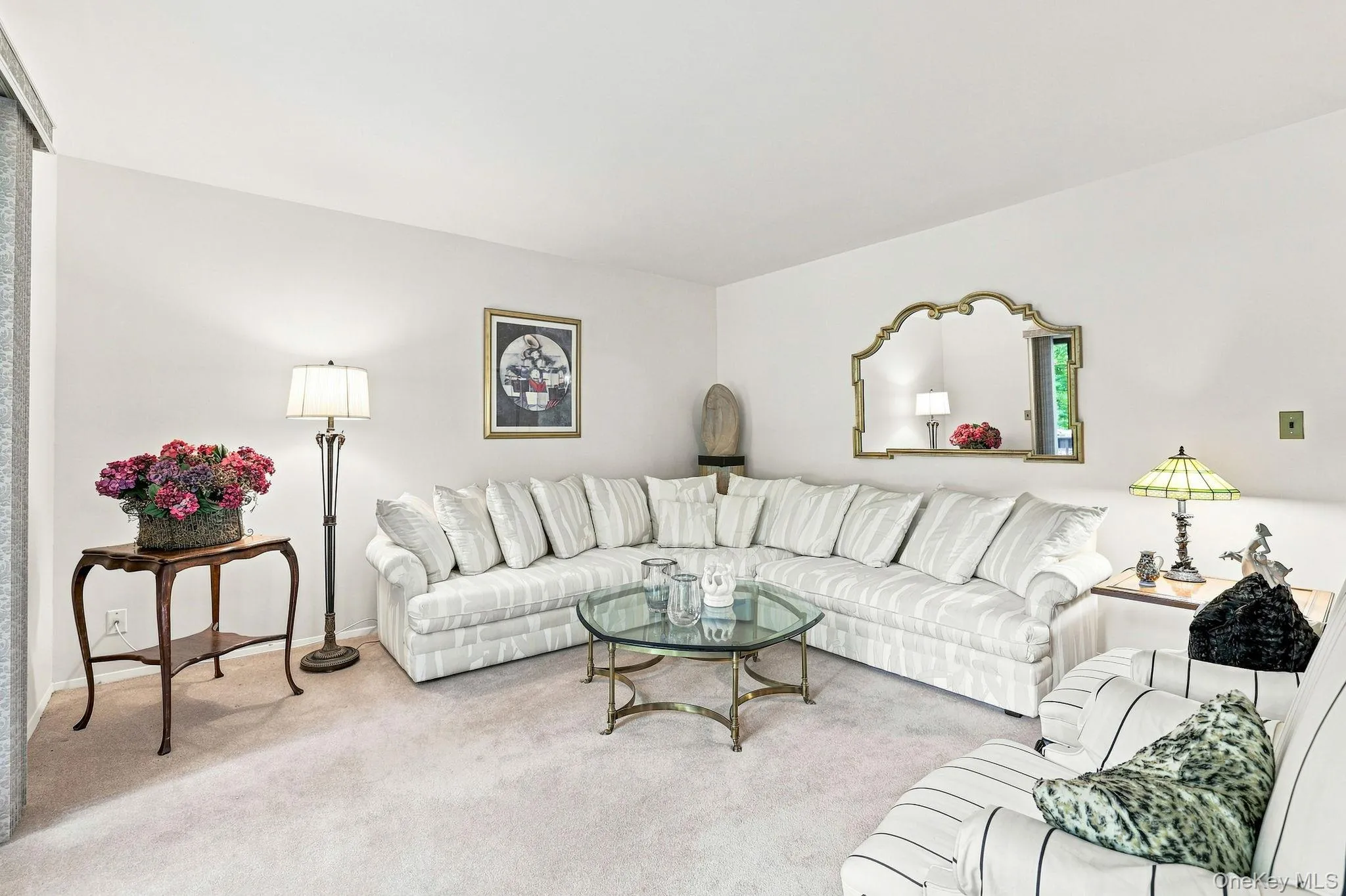 Living room accommodating large sectional and additional seating Living room accommodating large sectional and additional seating