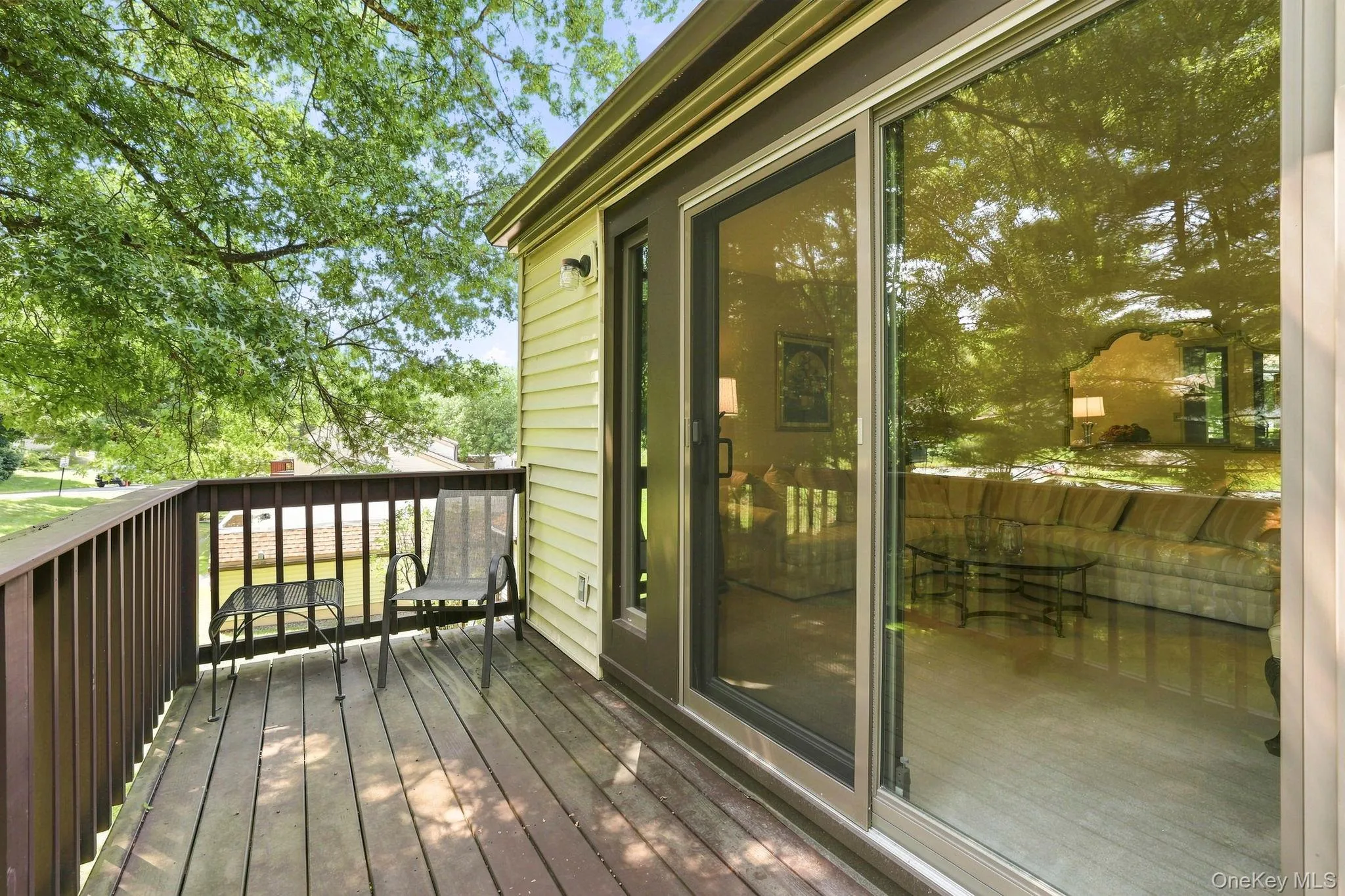 Private deck with sliding doors from the living room Private deck with sliding doors from the living room