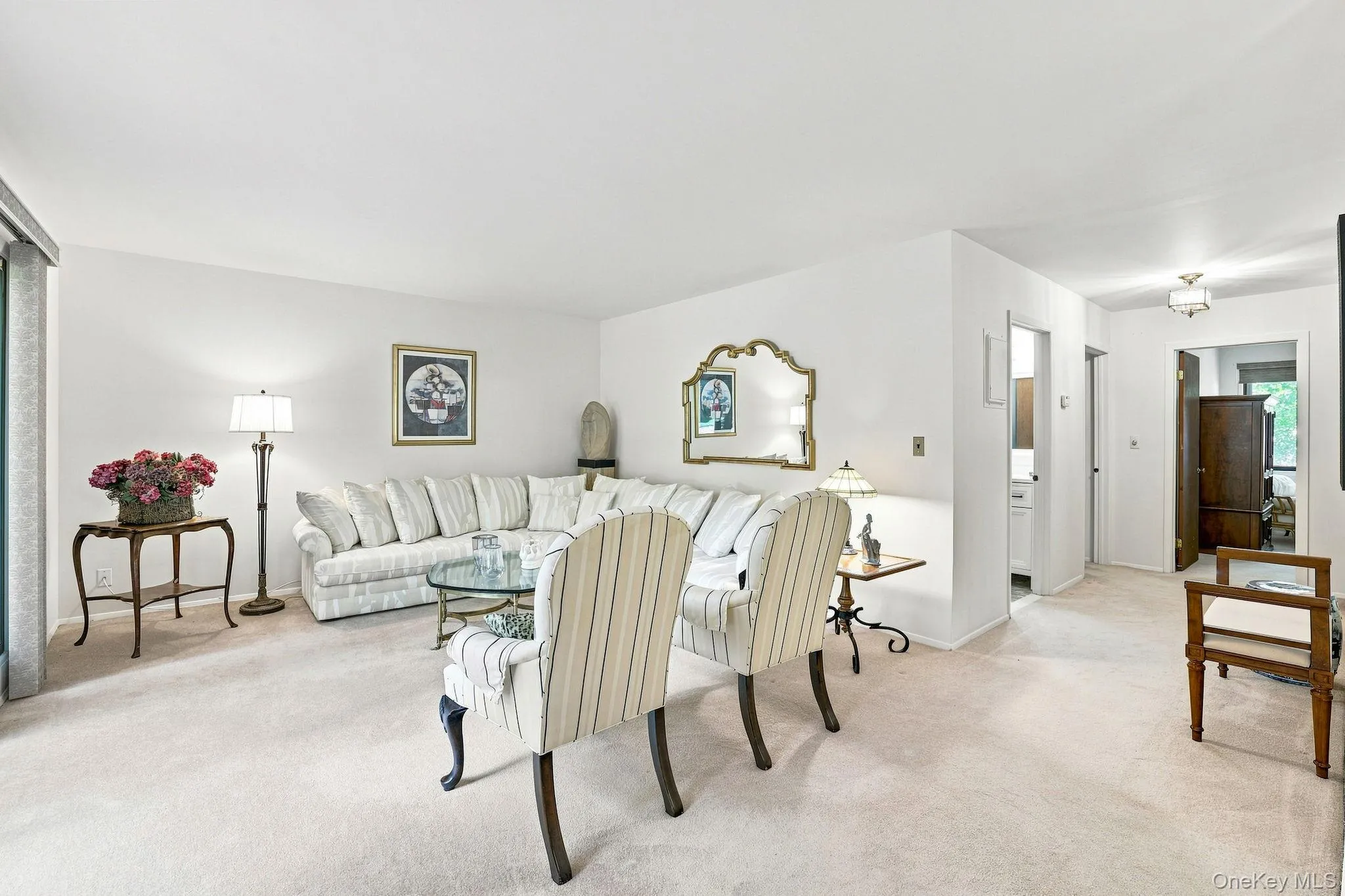 Living room with view of hall to bedrooms and bath Living room with view of hall to bedrooms and bath