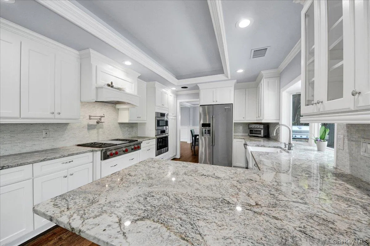 Eat-in Kitchen with granite countertops and stainless steel appliances Eat-in Kitchen with granite countertops and stainless steel appliances
