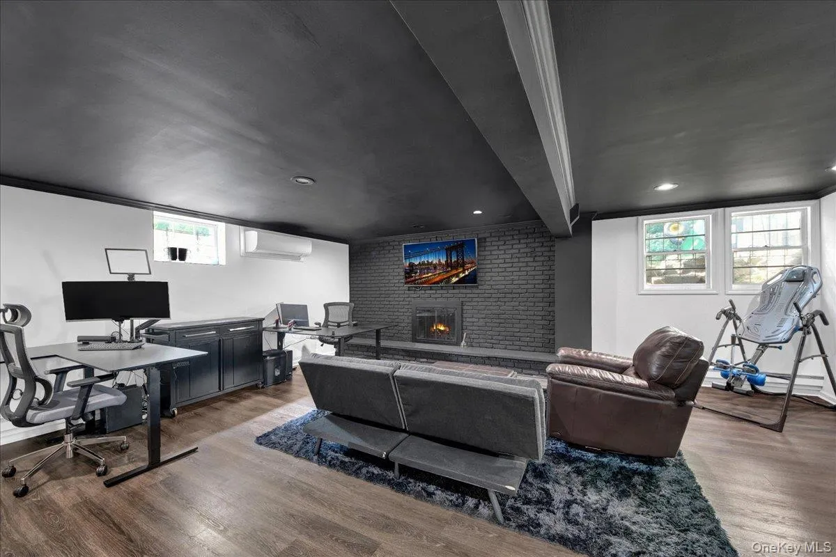 Completely updated and finished basement area with fireplace and half bathroom Completely updated and finished basement area with fireplace and half bathroom