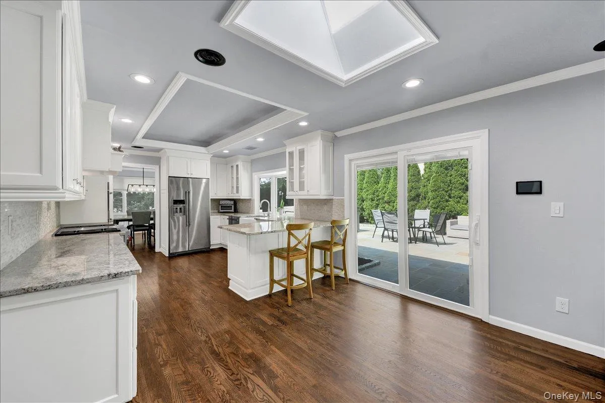 Eat-in Kitchen with granite countertops and sliding doors that lead to backyard Eat-in Kitchen with granite countertops and sliding doors that lead to backyard