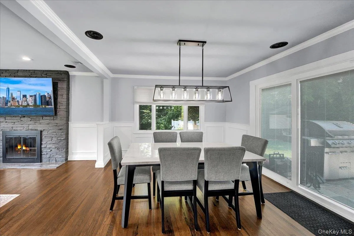 Dining room with chandelier, recessed lighting and sliding doors to backyard Dining room with chandelier, recessed lighting and sliding doors to backyard