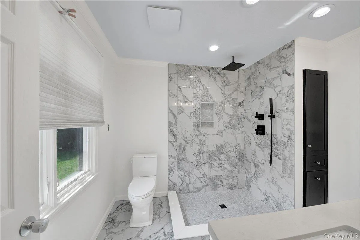 Brand new updated primary bathroom with heated floors Brand new updated primary bathroom with heated floors