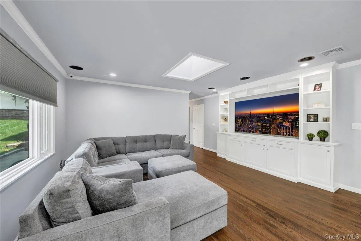 Second living room on main level with built in tv hutch Second living room on main level with built in tv hutch