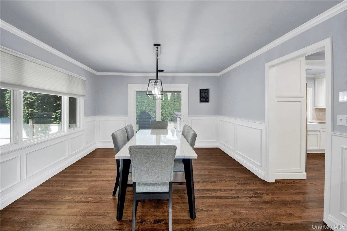 Dining room with chandelier, recessed lighting and sliding doors to backyard Dining room with chandelier, recessed lighting and sliding doors to backyard